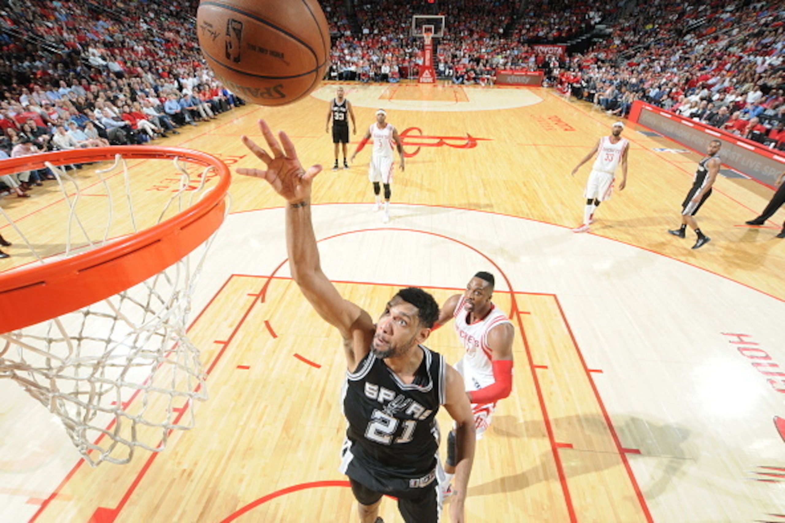 HOUSTON, TX - APRIL 10: Tim Duncan #21 of the San Antonio Spurs shoots against the Houston Rockets on April 10, 2015 at the Toyota Center in Houston, Texas. NOTE TO USER: User expressly acknowledges and agrees that, by downloading and or using this photog