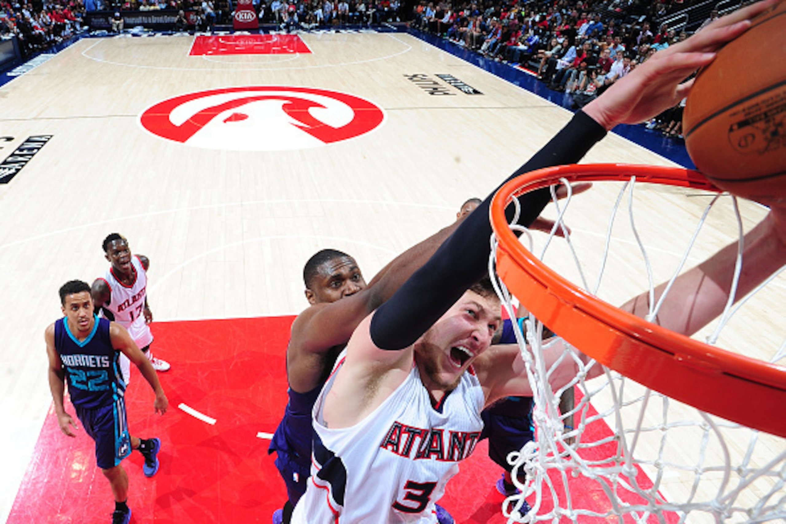 ATLANTA, GA - APRIL 10: Mike Muscala #31 of the Atlanta Hawks goes for the dunk against the Charlotte Hornets during the game on April 10, 2015 at Philips Arena in Atlanta, Georgia. NOTE TO USER: User expressly acknowledges and agrees that, by downloading