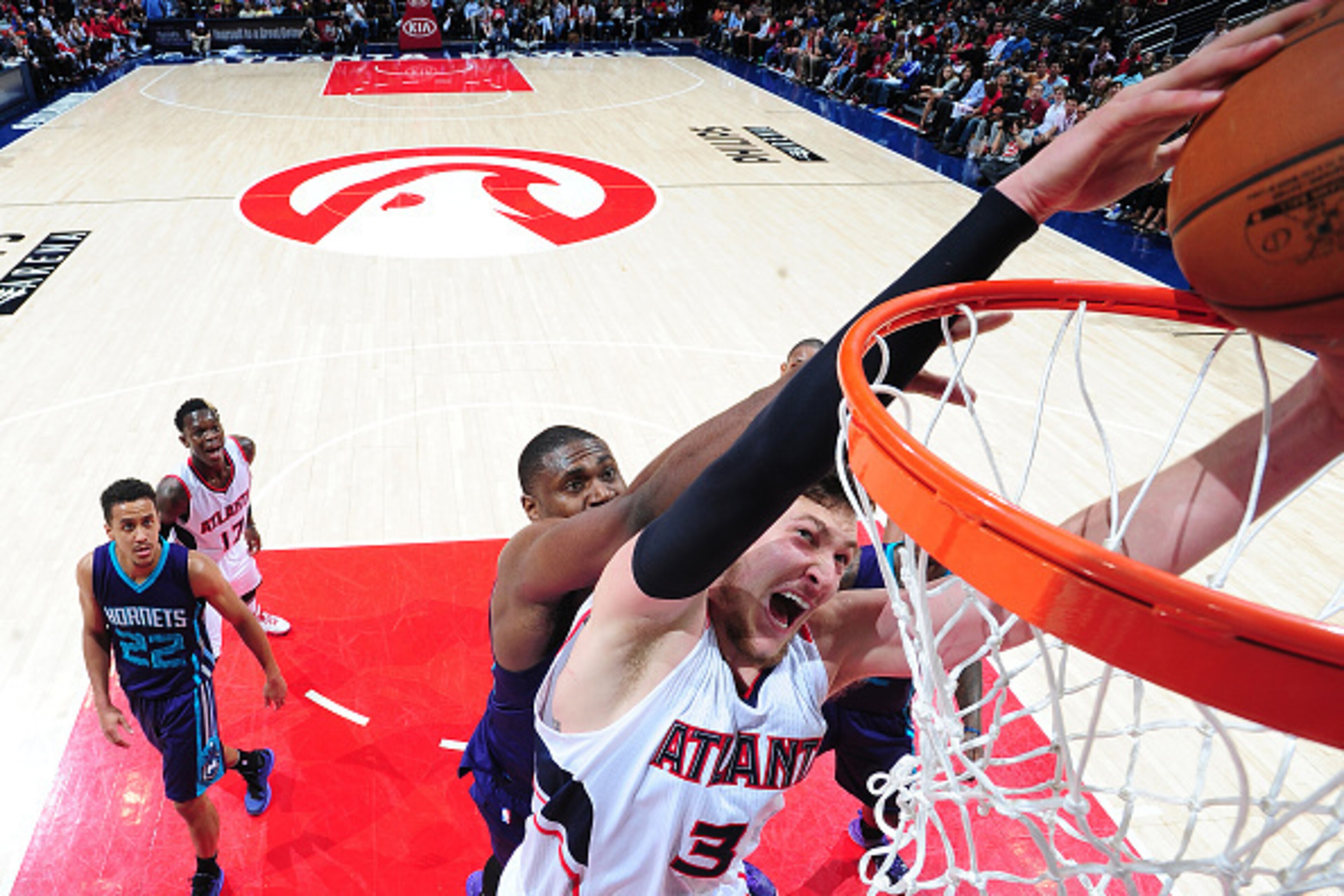 ATLANTA, GA - APRIL 10: Mike Muscala #31 of the Atlanta Hawks goes for the dunk against the Charlotte Hornets during the game on April 10, 2015 at Philips Arena in Atlanta, Georgia. NOTE TO USER: User expressly acknowledges and agrees that, by downloading