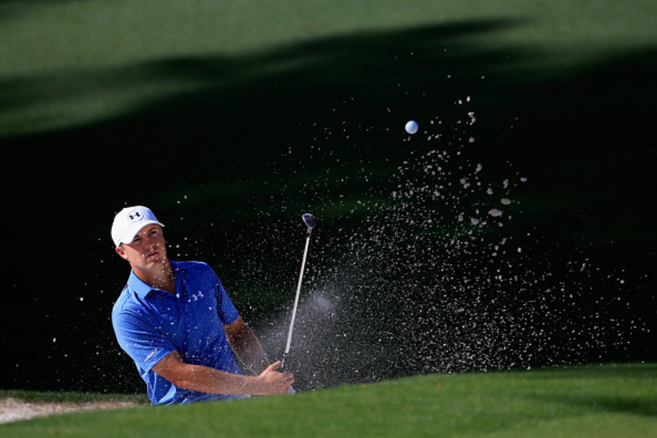 AUGUSTA, GA - APRIL 11:  Jordan Spieth of the United States plays a bunker shot on the tenth hole during the third round of the 2015 Masters Tournament at Augusta National Golf Club on April 11, 2015 in Augusta, Georgia.  (Photo by Jamie Squire/Getty Imag