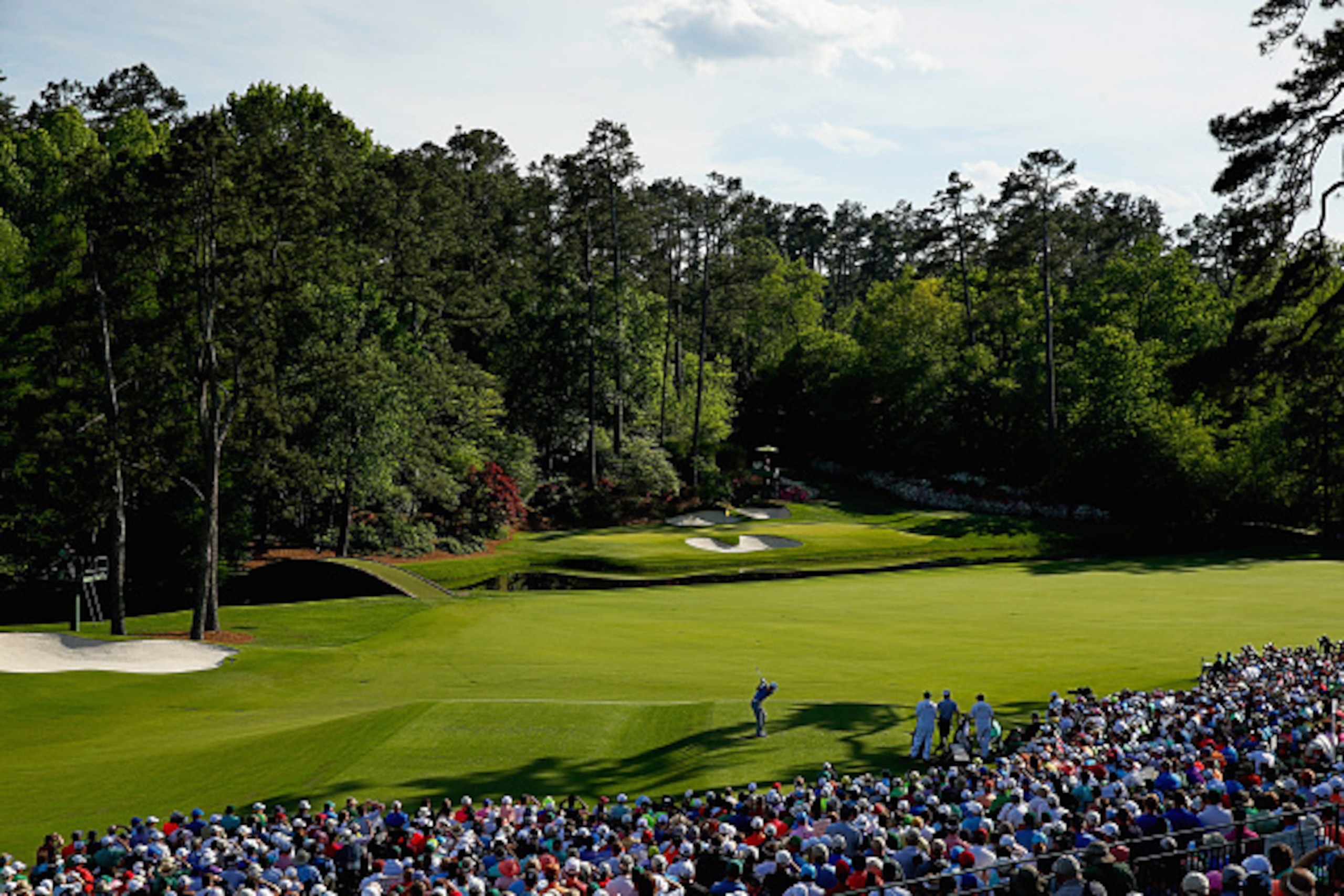 AUGUSTA, GA - APRIL 11: Jordan Spieth of the United States hits his tee shot on the 12th hole as Charley Hoffman of the United States looks on during the third round of the 2015 Masters Tournament at Augusta National Golf Club on April 11, 2015 in Augusta AUGUSTA, GA - APRIL 11: Jordan Spieth of the United States hits his tee shot on the 12th hole as Charley Hoffman of the United States looks on during the third round of the 2015 Masters Tournament at Augusta National Golf Club on April 11, 2015 in Augusta