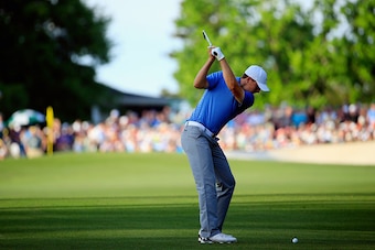 AUGUSTA, GA - APRIL 11:  Jordan Spieth of the United States hits his second shot on the 18th hole during the third round of the 2015 Masters Tournament at Augusta National Golf Club on April 11, 2015 in Augusta, Georgia.  (Photo by Jamie Squire/Getty Imag