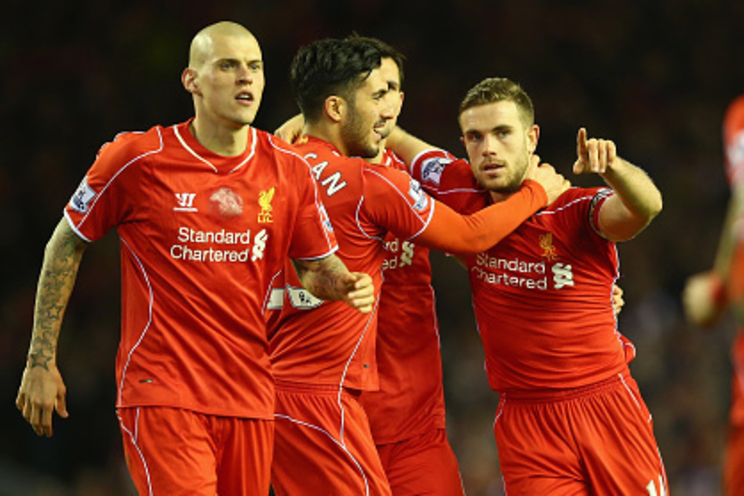LIVERPOOL, ENGLAND - MARCH 04:  Jordan Henderson (C) of Liverpool takes the plaudits after setting up his sides second goal during the Barclays Premier League match between Liverpool and Burnley at Anfield on March 4, 2015 in Liverpool, England.  (Photo b