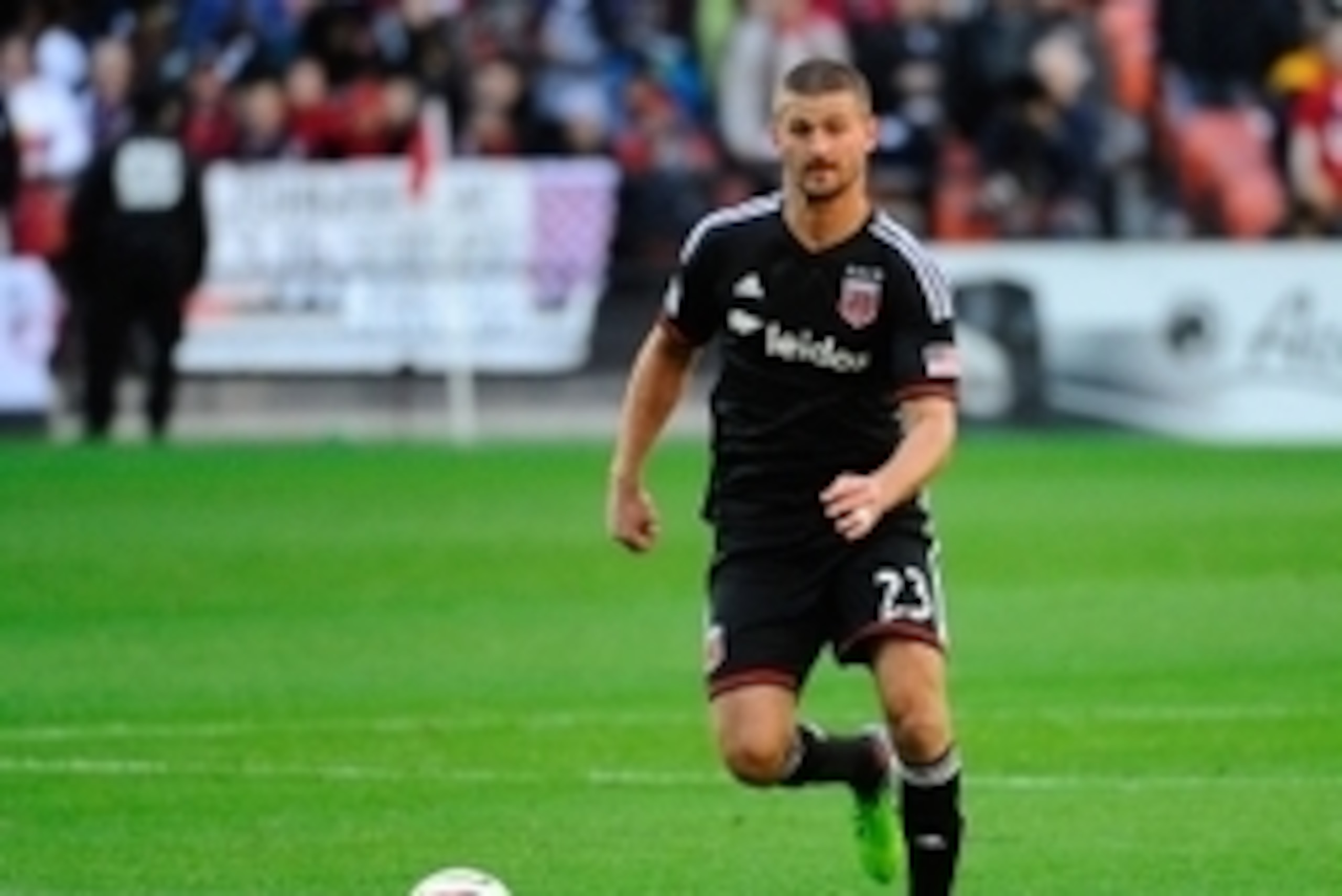 Nov 8, 2014; Washington, DC, USA; D.C. United midfielder/defender Perry Kitchen (23) controls the ball against the New York Red Bulls during the first half at Robert F. Kennedy Memorial. Mandatory Credit: Brad Mills-USA TODAY Sports