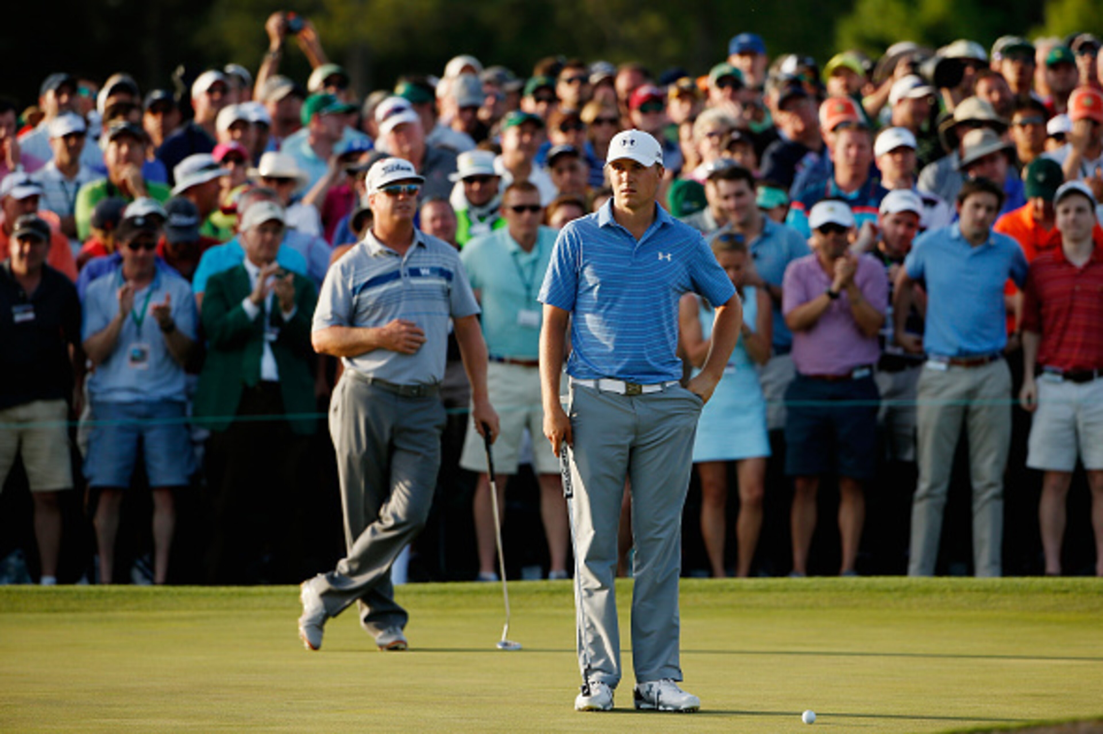 AUGUSTA, GA - APRIL 11: (L-R) Charley Hoffman of the United States and Jordan Spieth of the United States wait on the 18th green during the third round of the 2015 Masters Tournament at Augusta National Golf Club on April 11, 2015 in Augusta, Georgia. (P AUGUSTA, GA - APRIL 11: (L-R) Charley Hoffman of the United States and Jordan Spieth of the United States wait on the 18th green during the third round of the 2015 Masters Tournament at Augusta National Golf Club on April 11, 2015 in Augusta, Georgia. (P