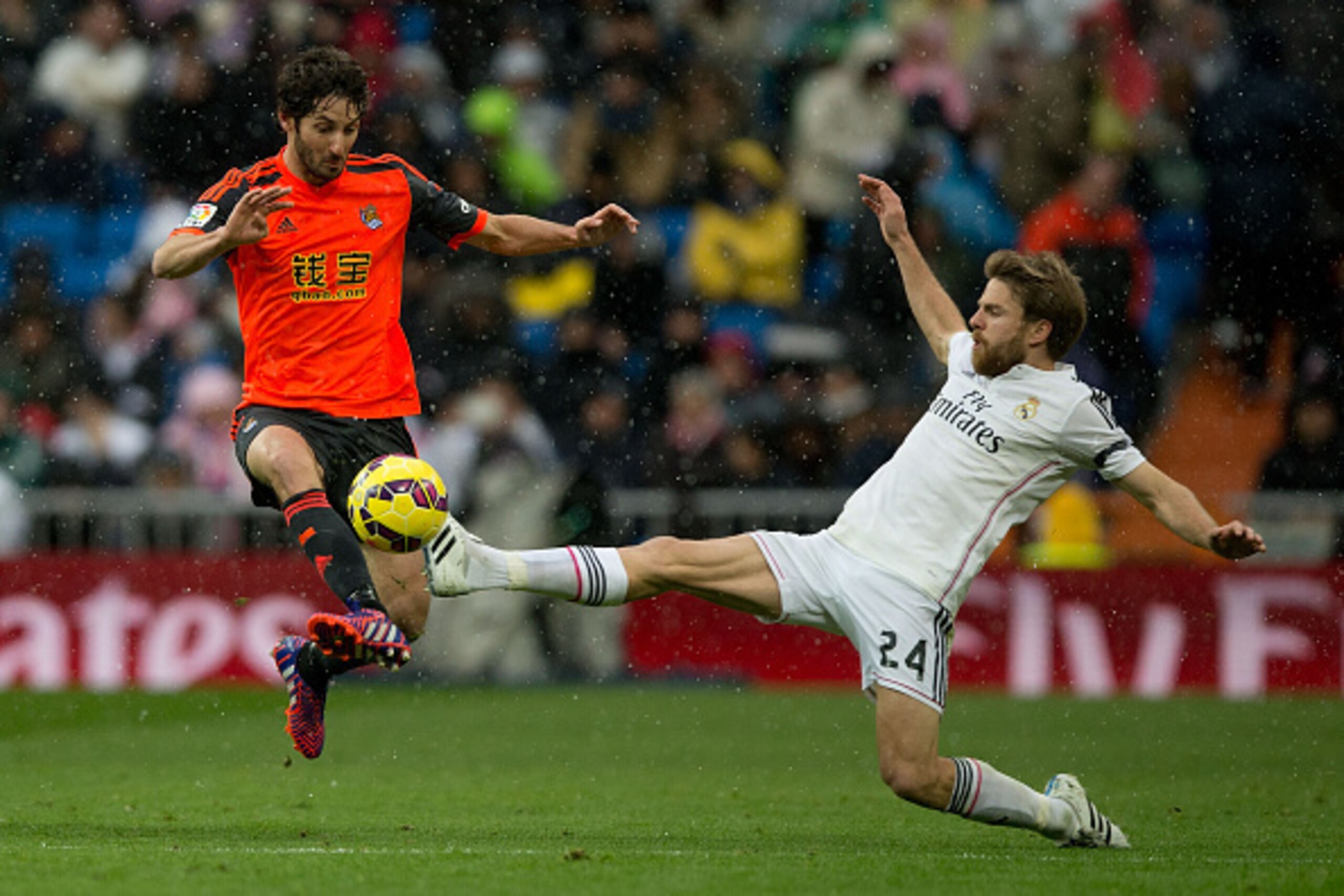 MADRID, SPAIN - JANUARY 31: Esteban Granero (L) Real Sociedad de Futbol competes for the ball with Asier Illarramendi (R) of Real Madrid CF during the La Liga match between Real Madrid CF and Real Sociedad de Futbol at Estadio Santiago Bernabeu on January MADRID, SPAIN - JANUARY 31: Esteban Granero (L) Real Sociedad de Futbol competes for the ball with Asier Illarramendi (R) of Real Madrid CF during the La Liga match between Real Madrid CF and Real Sociedad de Futbol at Estadio Santiago Bernabeu on January
