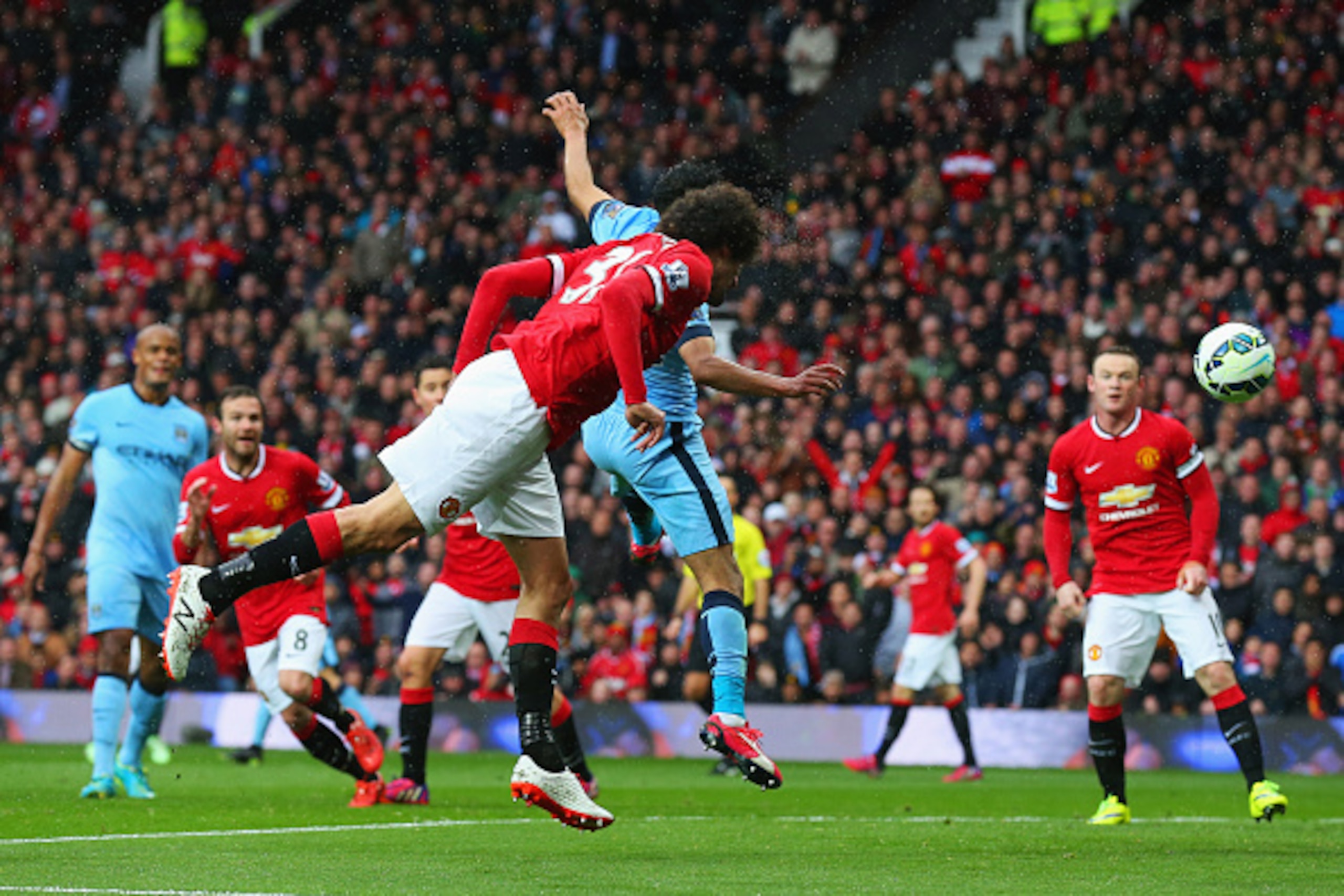 MANCHESTER, ENGLAND - APRIL 12:  Marouane Fellaini of Manchester United scores their second goal with a header during the Barclays Premier League match between Manchester United and Manchester City at Old Trafford on April 12, 2015 in Manchester, England.