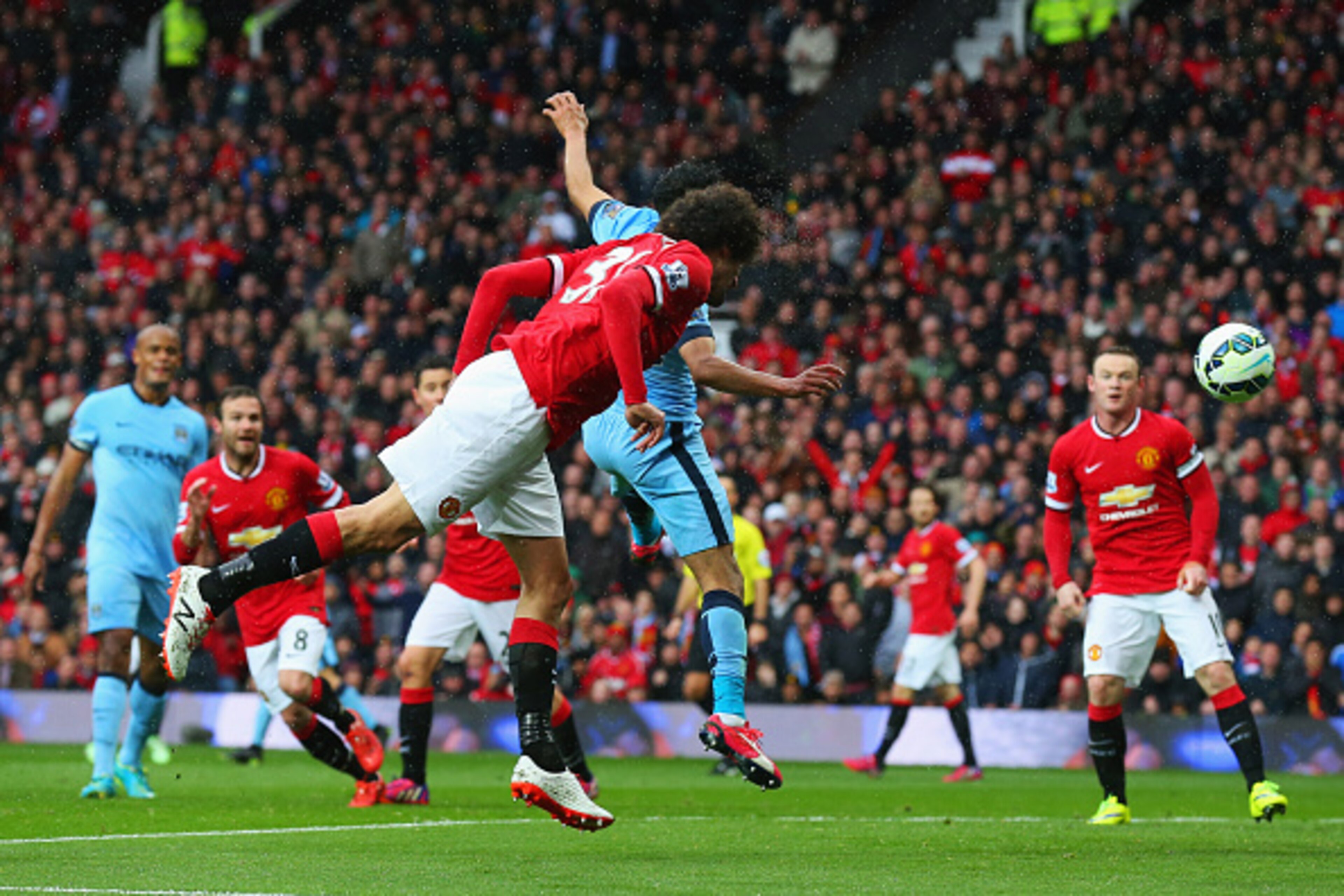 MANCHESTER, ENGLAND - APRIL 12:  Marouane Fellaini of Manchester United scores their second goal with a header during the Barclays Premier League match between Manchester United and Manchester City at Old Trafford on April 12, 2015 in Manchester, England.