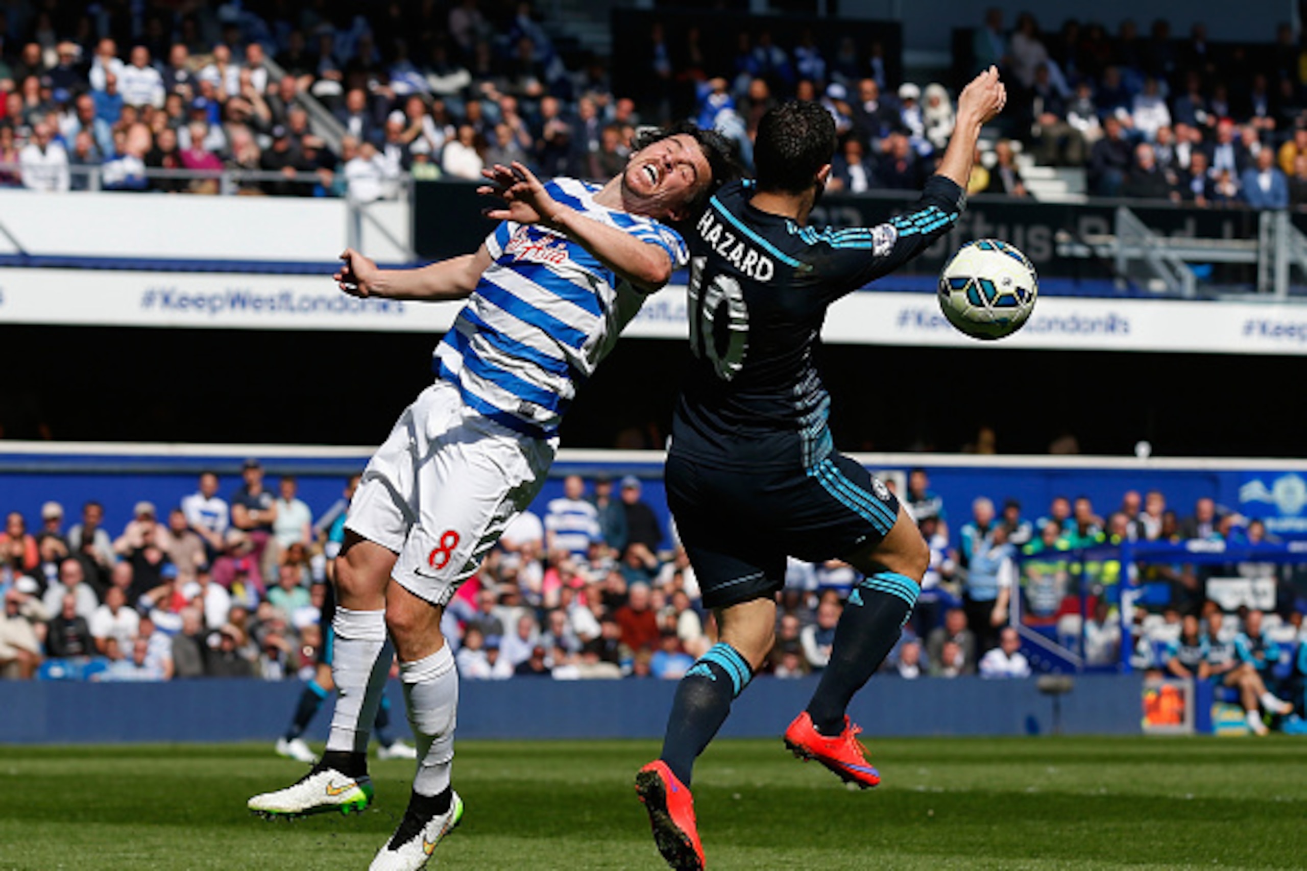 LONDON, ENGLAND - APRIL 12:  Joey Barton of QPR and Eden Hazard of Chelsea battle for the ball during the Barclays Premier League match between Queens Park Rangers and Chelsea at Loftus Road on April 12, 2015 in London, England.  (Photo by Steve Bardens/G