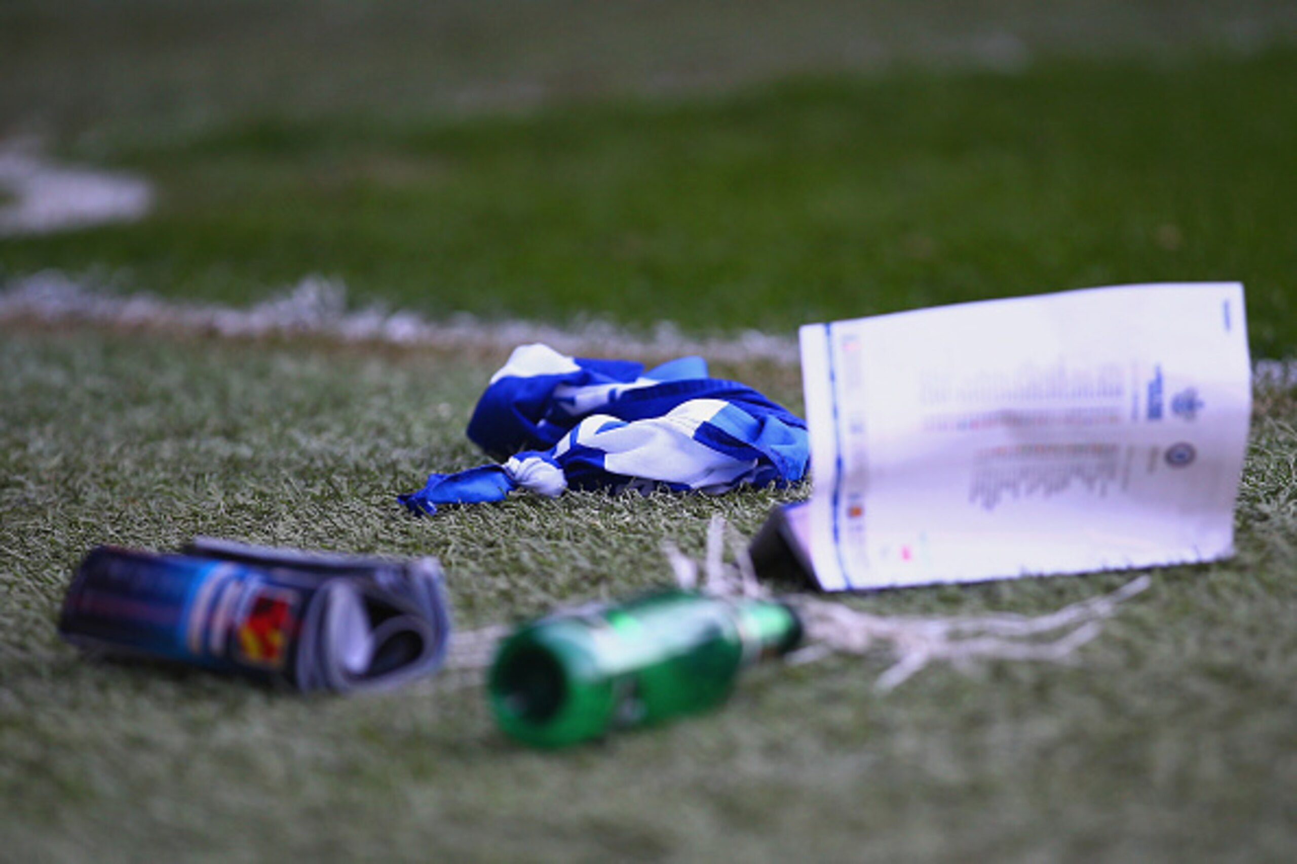 LONDON, ENGLAND - APRIL 12:  Objects that were thrown at Cesc Fabregas of Chelsea as he celebrated his goal lie on the pitch during the Barclays Premier League match between Queens Park Rangers and Chelsea at Loftus Road on April 12, 2015 in London, Engla