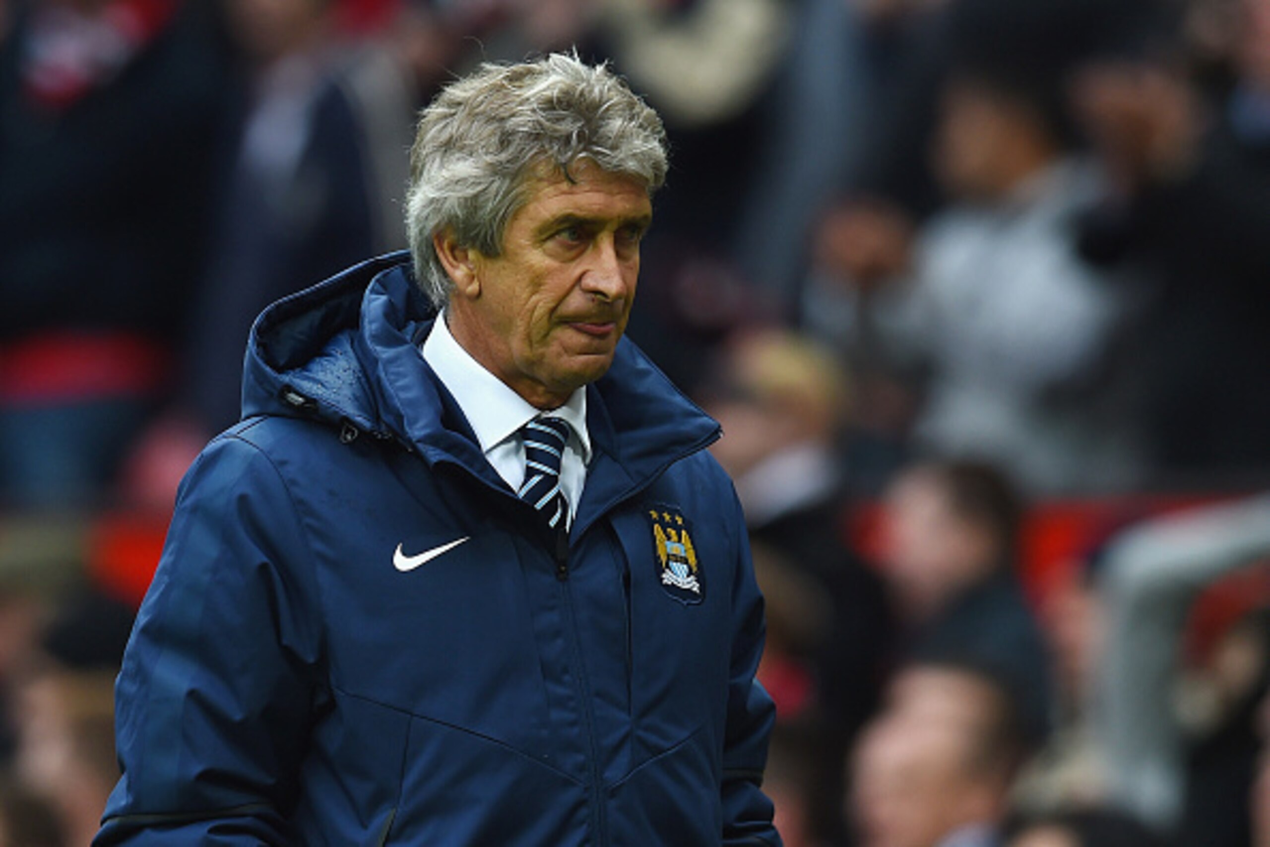 MANCHESTER, ENGLAND - APRIL 12:  Manuel Pellegrini manager of Manchester City looks depsondetn in defeat after the Barclays Premier League match between Manchester United and Manchester City at Old Trafford on April 12, 2015 in Manchester, England.  (Phot
