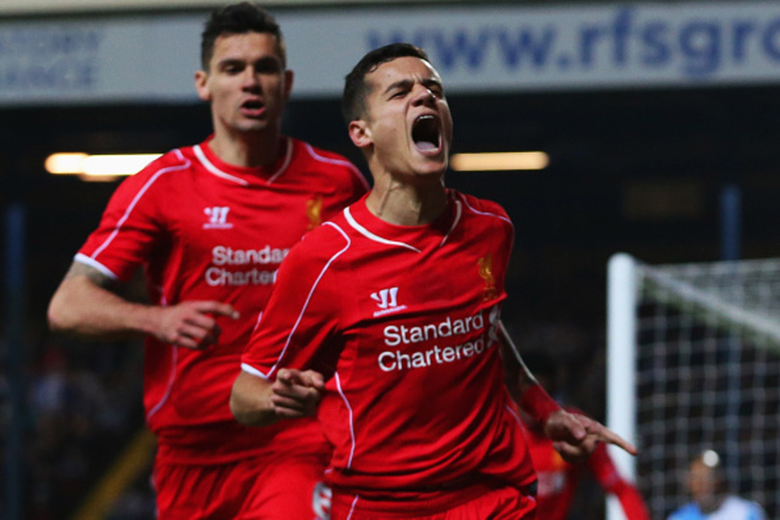 BLACKBURN, ENGLAND - APRIL 08:  Philippe Coutinho of Liverpool (R) celebrates with Dejan Lovren as he scores their first goal during the FA Cup Quarter Final Replay match between Blackburn Rovers and Liverpool at Ewood Park on April 8, 2015 in Blackburn, 