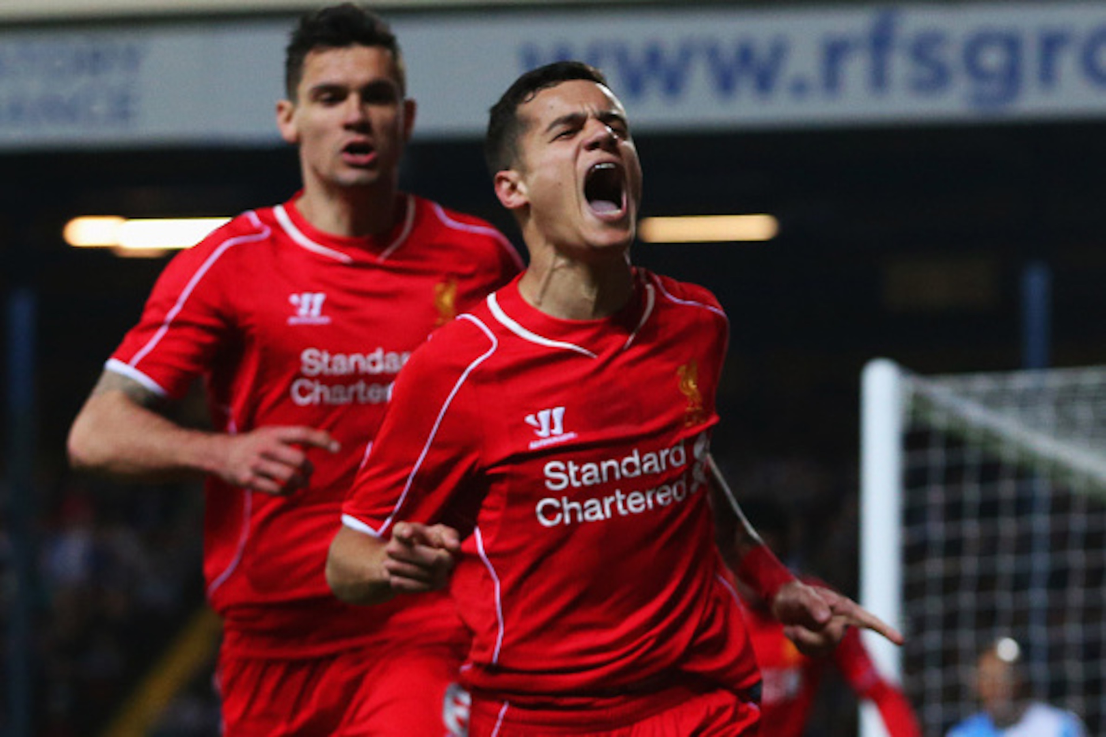 BLACKBURN, ENGLAND - APRIL 08:  Philippe Coutinho of Liverpool (R) celebrates with Dejan Lovren as he scores their first goal during the FA Cup Quarter Final Replay match between Blackburn Rovers and Liverpool at Ewood Park on April 8, 2015 in Blackburn, 