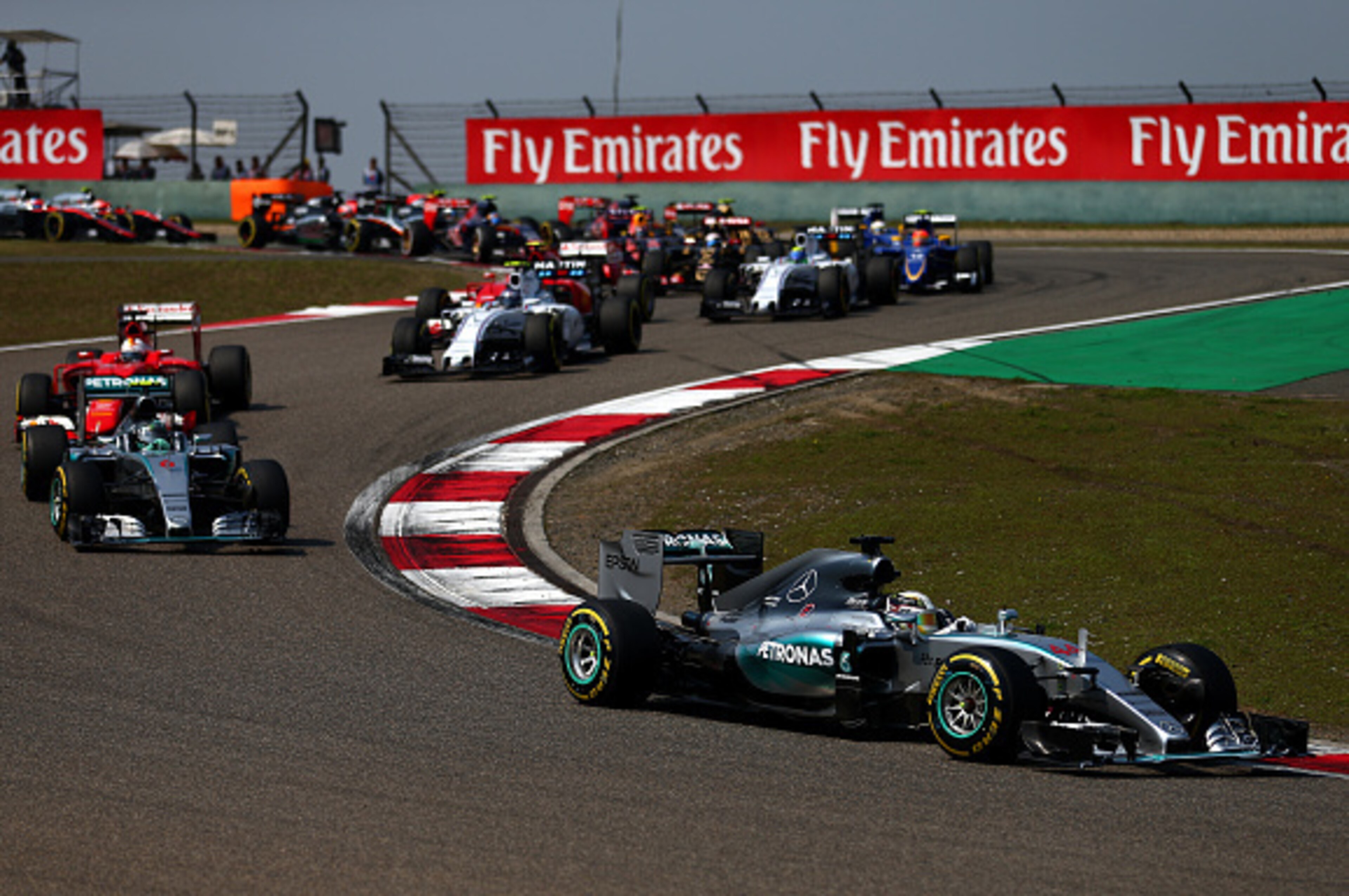 SHANGHAI, CHINA - APRIL 12:  Lewis Hamilton of Great Britain and Mercedes GP leads the field during the Formula One Grand Prix of China at Shanghai International Circuit on April 12, 2015 in Shanghai, China.  (Photo by Dan Istitene/Getty Images)