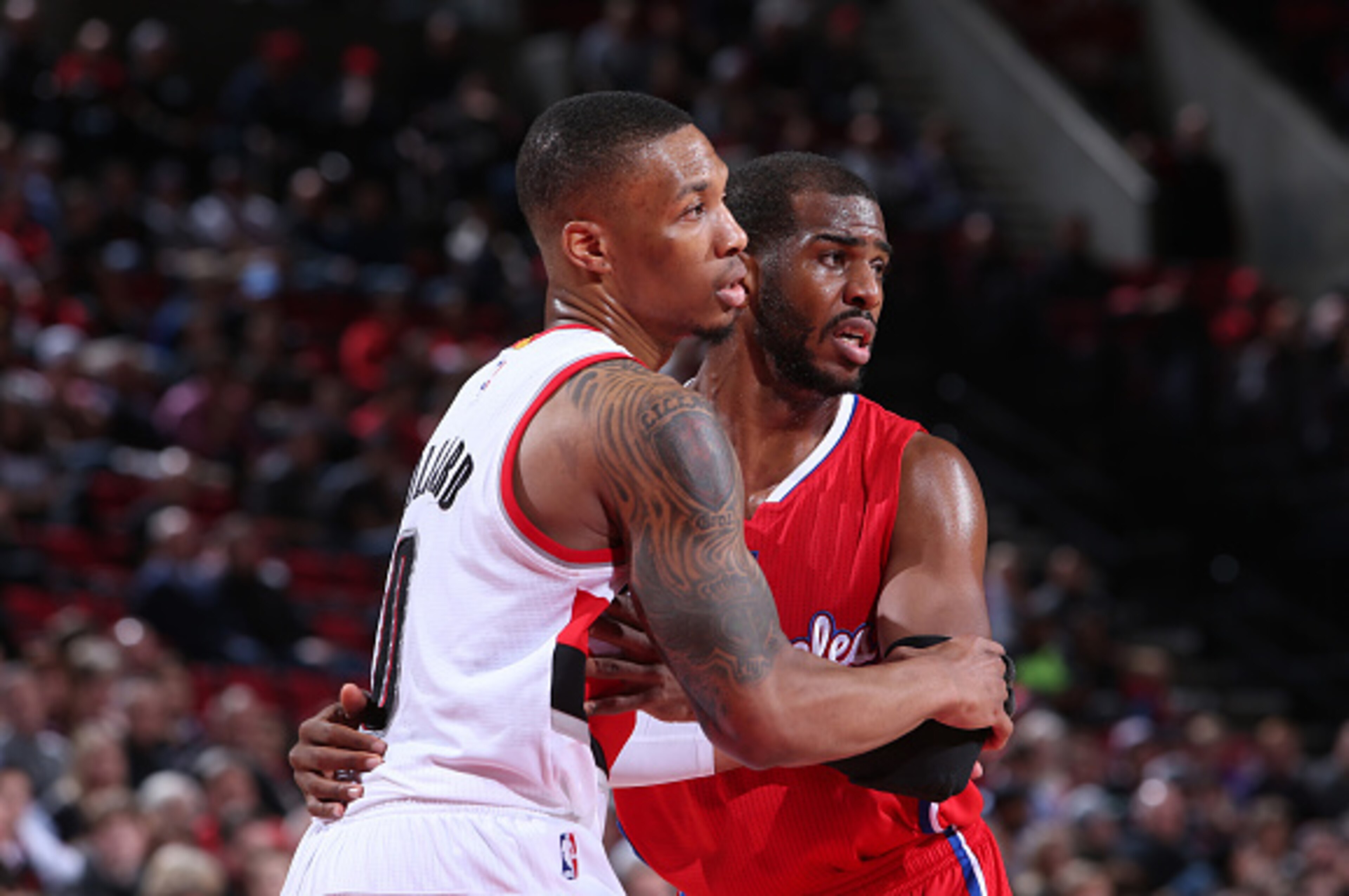 PORTLAND, OR - JANUARY 14: Chris Paul #3 of the Los Angeles Clippers and Damian Lillard #0 of the Portland Trail Blazers stand on the court on January 14, 2015 at the Moda Center Arena in Portland, Oregon. NOTE TO USER: User expressly acknowledges and ag PORTLAND, OR - JANUARY 14: Chris Paul #3 of the Los Angeles Clippers and Damian Lillard #0 of the Portland Trail Blazers stand on the court on January 14, 2015 at the Moda Center Arena in Portland, Oregon. NOTE TO USER: User expressly acknowledges and ag