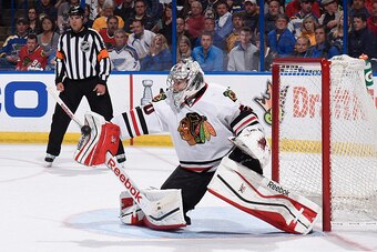 ST. LOUIS, MO - APRIL 9: Corey Crawford #50 of the Chicago Blackhawks defends the net against the St. Louis Blues on April 9, 2015 at the Scottrade Center in St. Louis, Missouri. (Photo by Scott Rovak/NHLI via Getty Images)