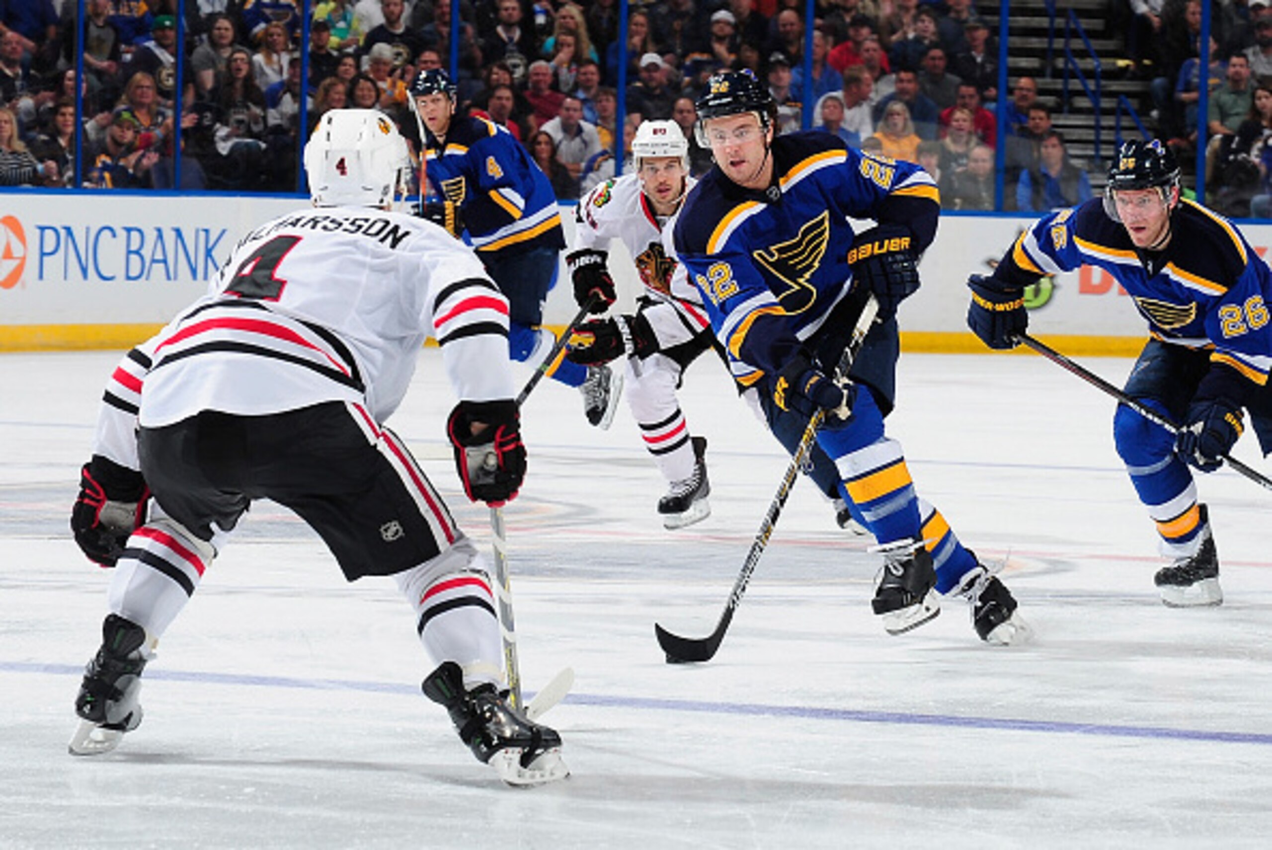 ST. LOUIS, MO - APRIL 9: Kevin Shattenkirk #22 of the St. Louis Blues handles the puck as Niklas Hjalmarsson #4 of the Chicago Blackhawks defends on April 9, 2015 at the Scottrade Center in St. Louis, Missouri. (Photo by Jeff Curry/NHLI via Getty Images)