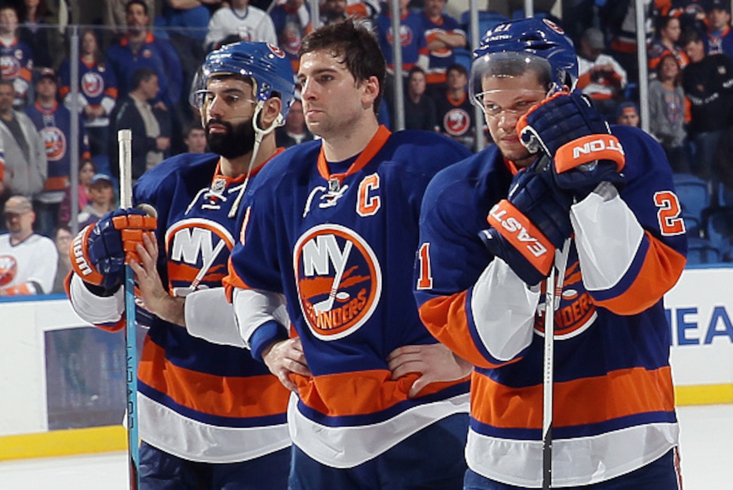 UNIONDALE, NY - APRIL 11: (l-r) A dejected Nick Leddy #2, John Tavares #91 and Kyle Okposo #21 of the New York Islanders wait for a postgame ceremony to begin following a loss to the Columbus Blue Jackets at the Nassau Veterans Memorial Coliseum on April UNIONDALE, NY - APRIL 11: (l-r) A dejected Nick Leddy #2, John Tavares #91 and Kyle Okposo #21 of the New York Islanders wait for a postgame ceremony to begin following a loss to the Columbus Blue Jackets at the Nassau Veterans Memorial Coliseum on April