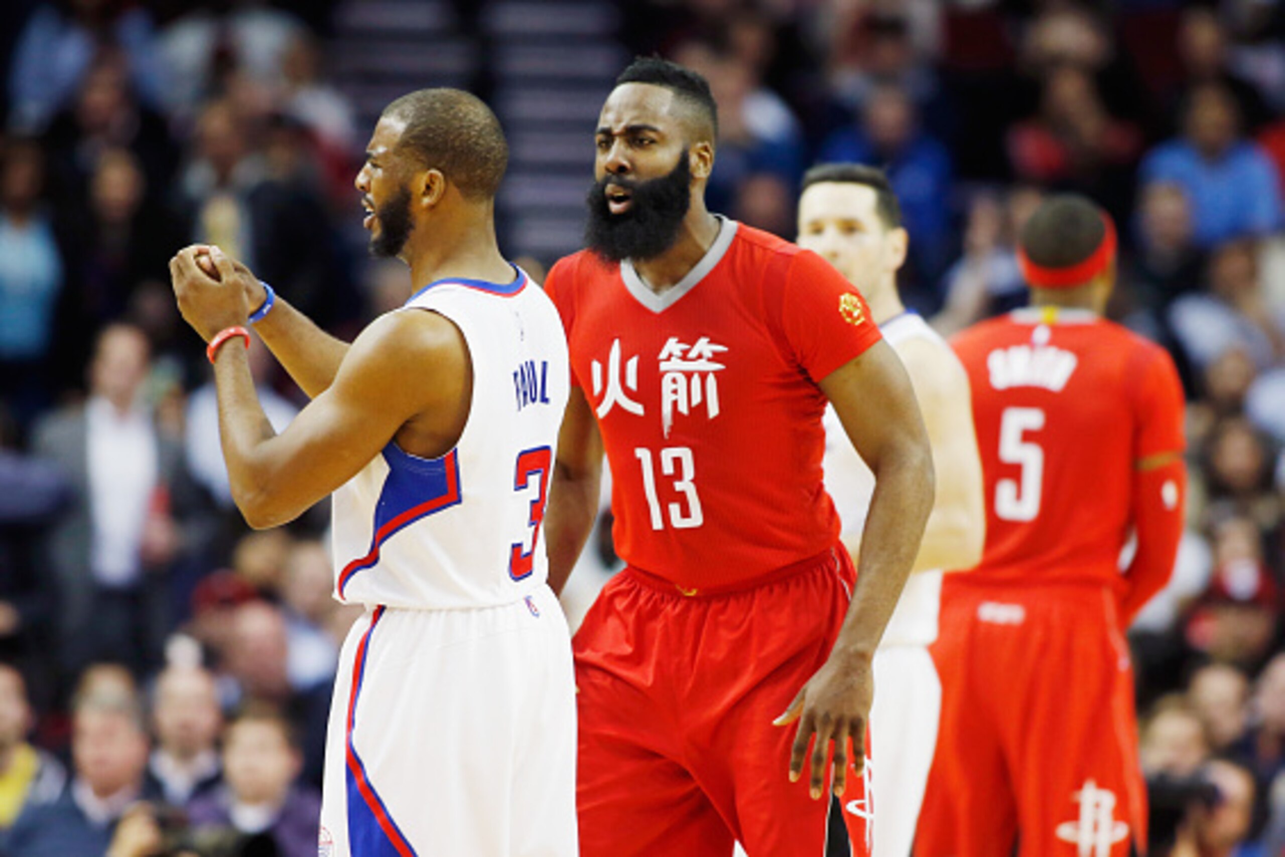 HOUSTON, TX - FEBRUARY 25:  James Harden #13 of the Houston Rockets shouts at  Chris Paul #3 of the Los Angeles Clippers after a foul during their game at the Toyota Center on February 25, 2015 in Houston, Texas. NOTE TO USER: User expressly acknowledges 