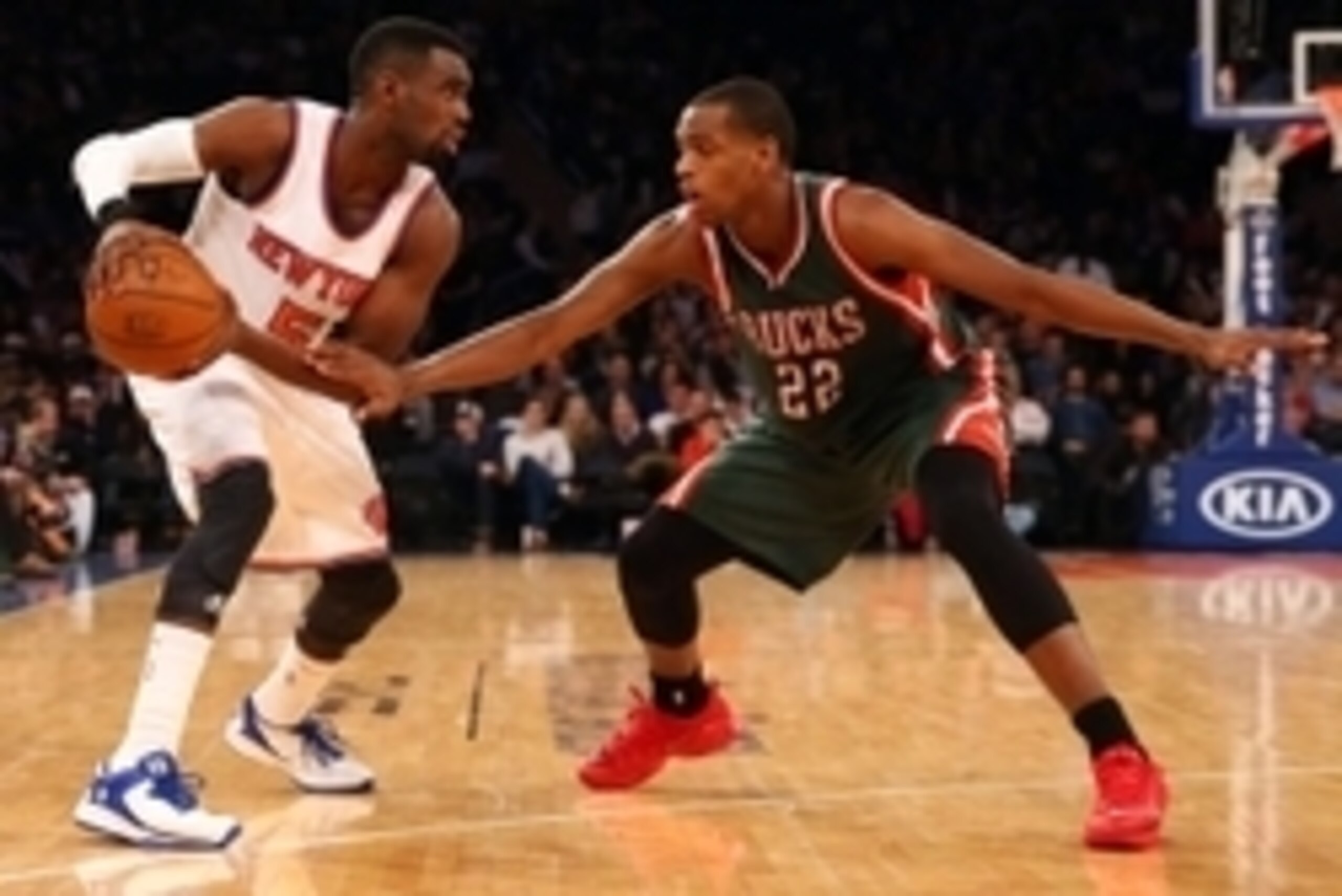 Apr 10, 2015; New York, NY, USA;  Milwaukee Bucks guard Khris Middleton (22) defends New York Knicks guard Tim Hardaway Jr. (5) during the third quarter at Madison Square Garden. New York Knicks won 99-91. Mandatory Credit: Anthony Gruppuso-USA TODAY Spor