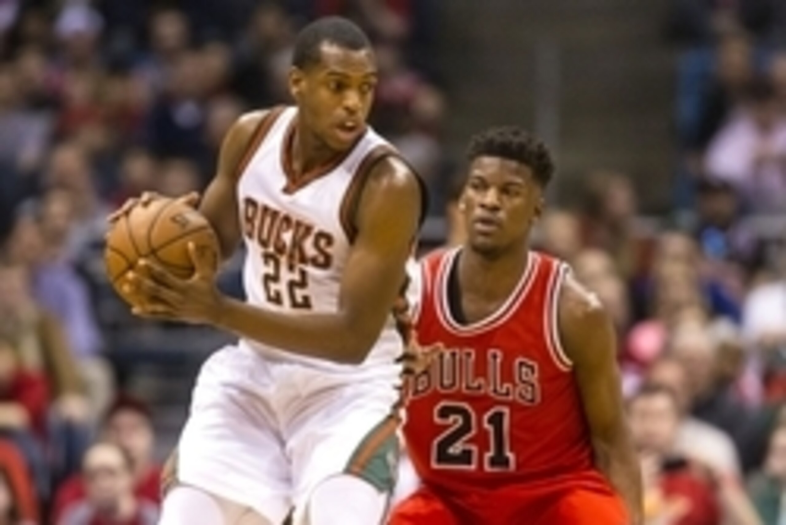 Apr 1, 2015; Milwaukee, WI, USA; Milwaukee Bucks guard Khris Middleton (22) holds the ball as Chicago Bulls guard Jimmy Butler (21) defends during the first quarter at BMO Harris Bradley Center. Mandatory Credit: Jeff Hanisch-USA TODAY Sports