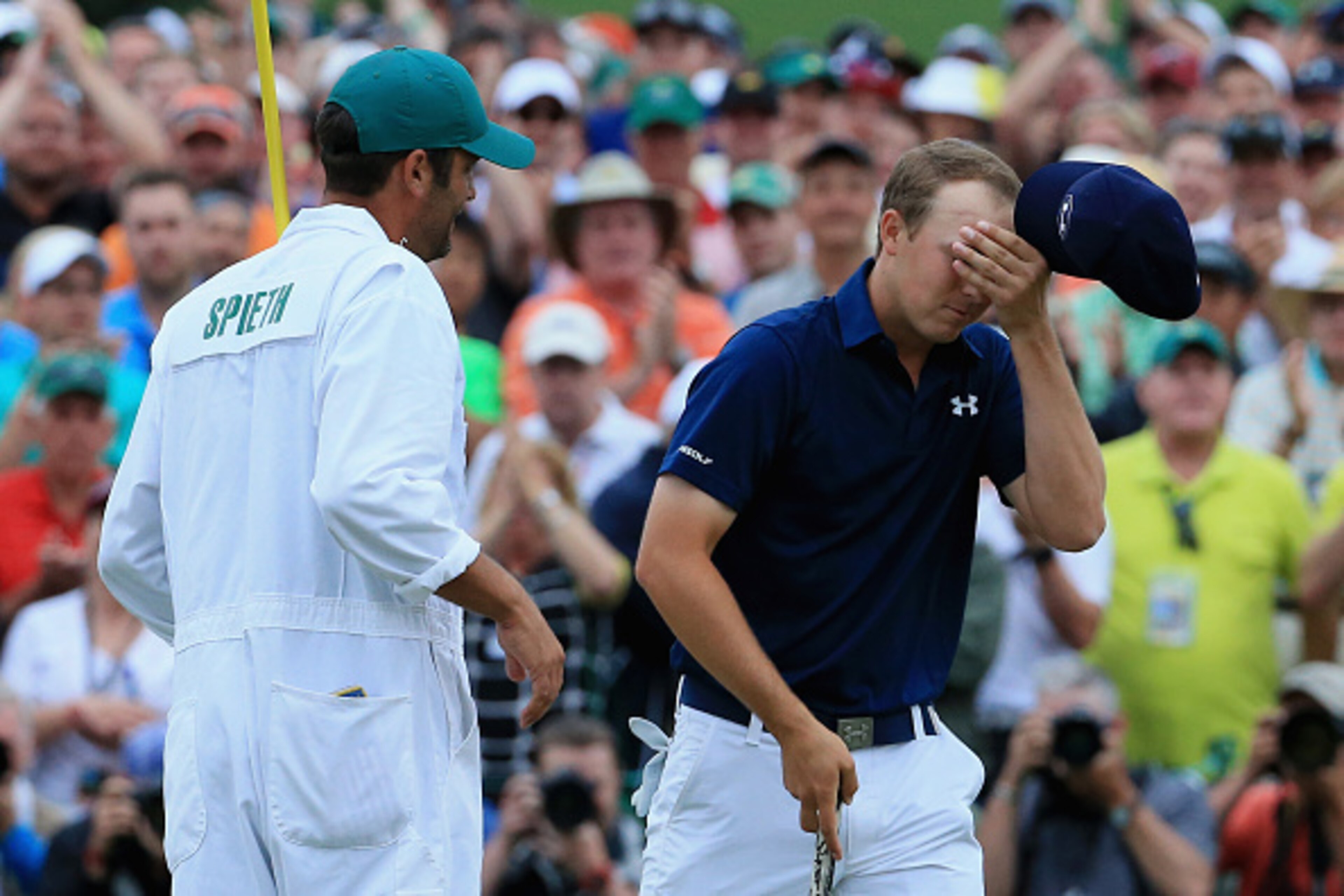 AUGUSTA, GA - APRIL 12:  Jordan Spieth of the United States celebrates with his caddie Michael Greller on the 18th green after his four-stroke victory at the 2015 Masters Tournament at Augusta National Golf Club on April 12, 2015 in Augusta, Georgia.  (Ph