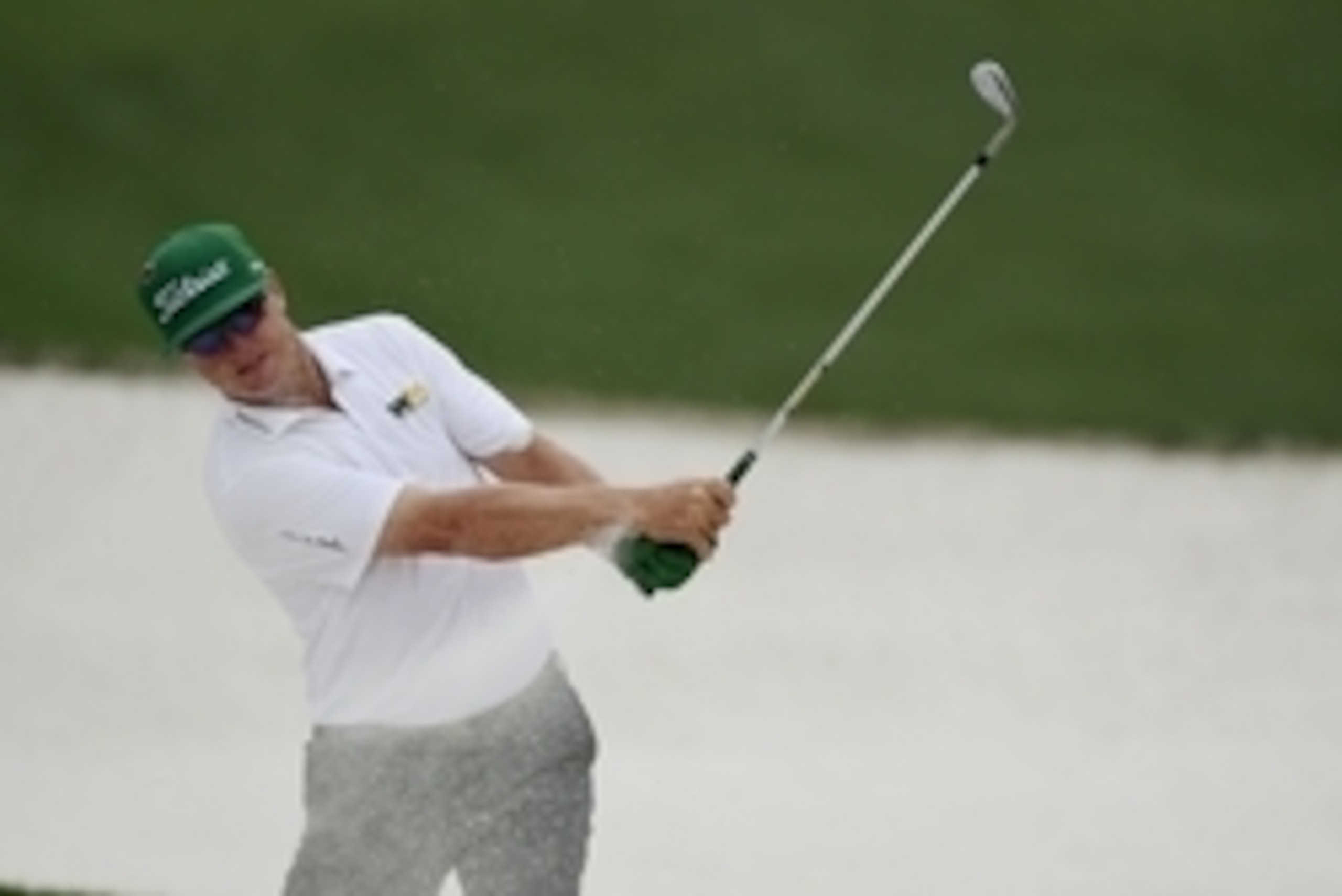 Apr 12, 2015; Augusta, GA, USA; Charley Hoffman hits out of a bunker on the 10th hole during the final round of The Masters golf tournament at Augusta National Golf Club. Mandatory Credit: Michael Madrid-USA TODAY Sports