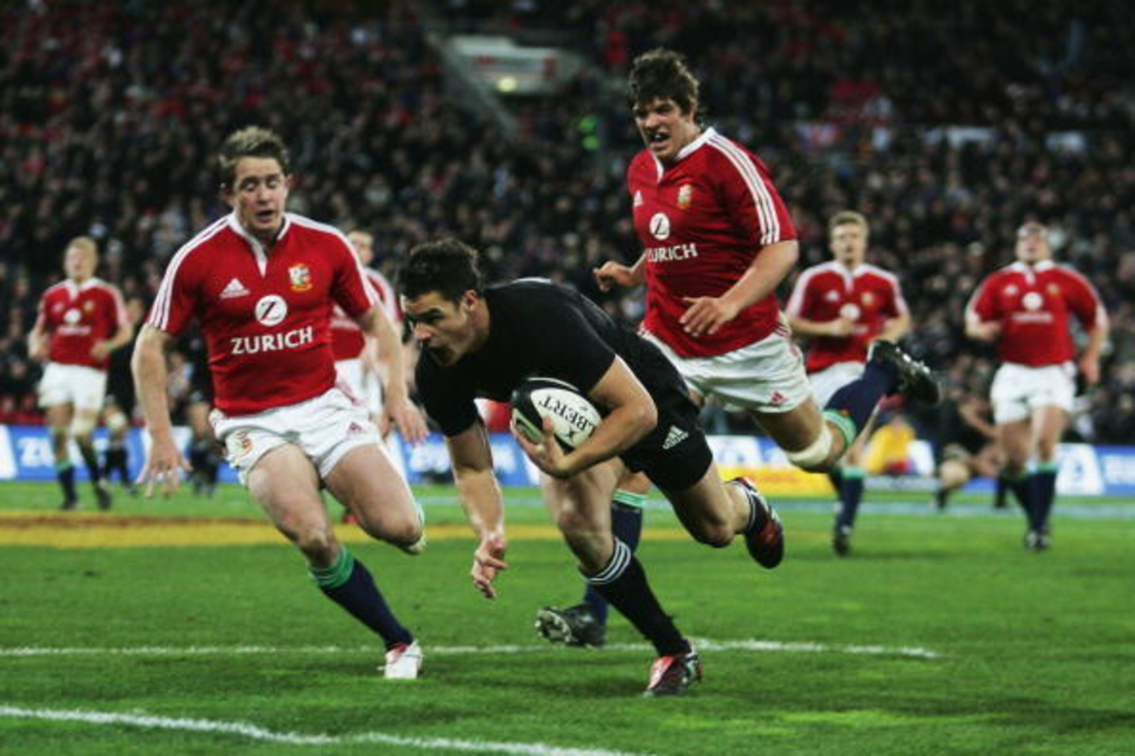 WELLINGTON, NEW ZEALAND - JULY 2: Dan Carter of the All Blacks goes over to score during the second test match between New Zealand All Blacks and British and Irish Lions at the Westpac Stadium on July 2, 2005 in Wellington, New Zealand.  (Photo by Shaun B