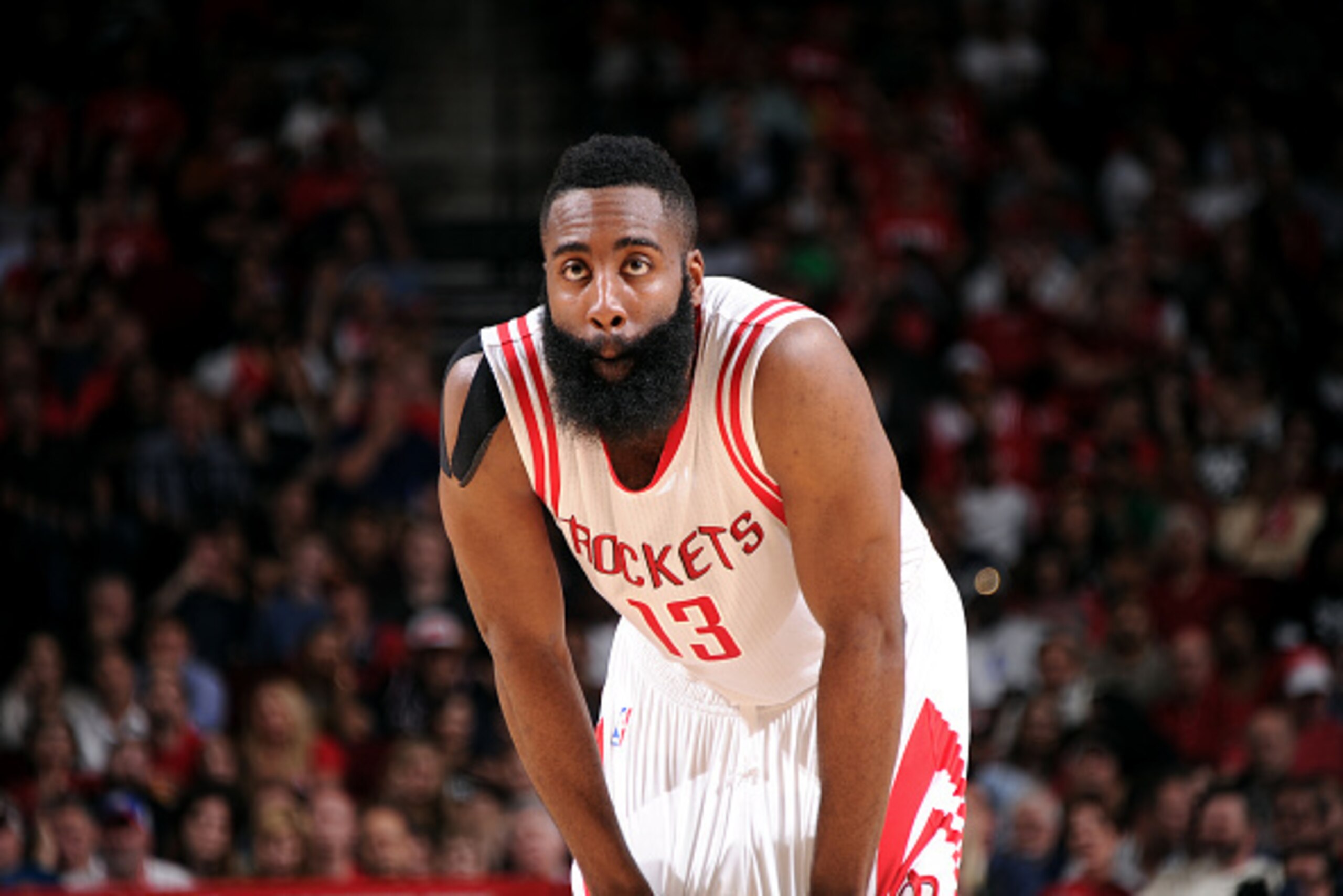 HOUSTON, TX - APRIL 10: James Harden #13 of the Houston Rockets stands on the court during a game against the San Antonio Spurs on April 10, 2015 at the Toyota Center in Houston, Texas. NOTE TO USER: User expressly acknowledges and agrees that, by downloa