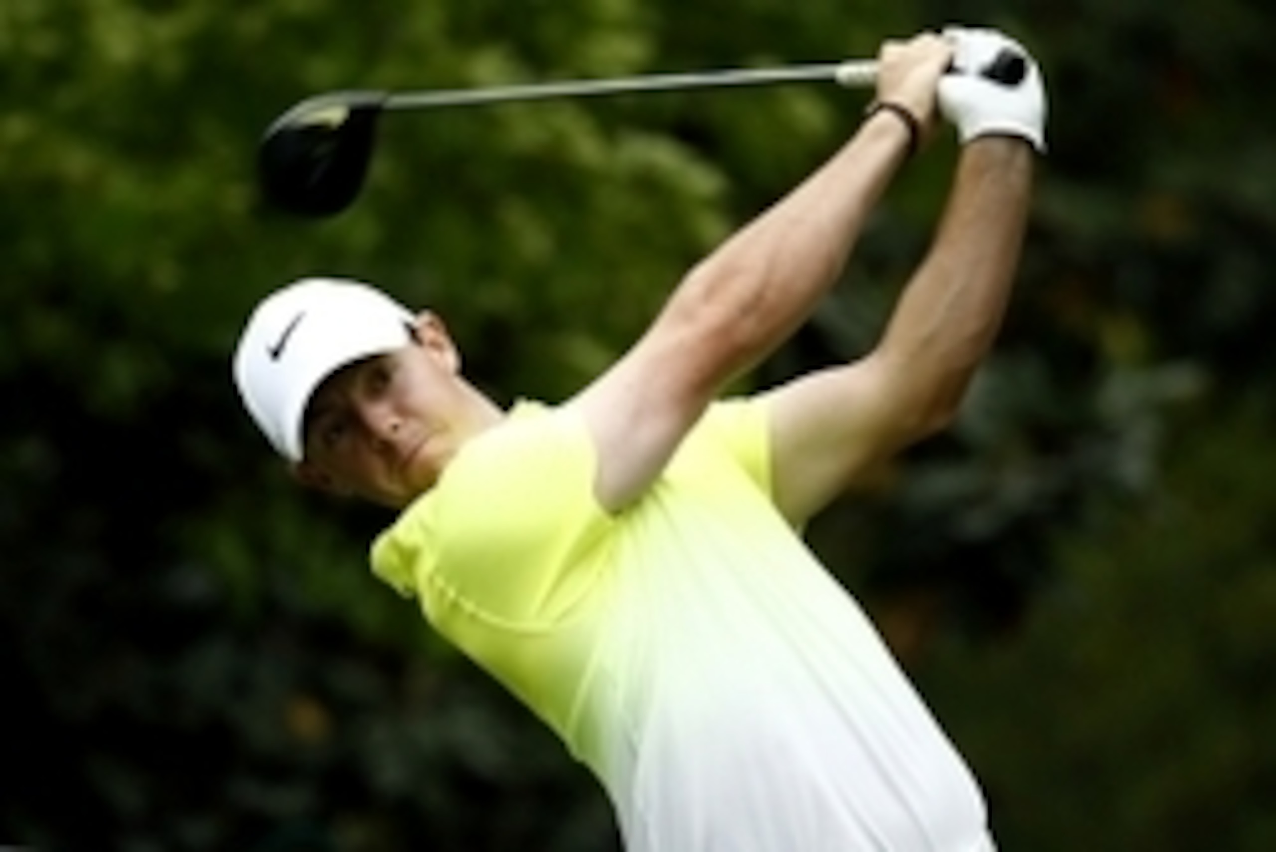 Apr 12, 2015; Augusta, GA, USA; Rory McIlroy hits his tee shot on the 7th hole during the final round of The Masters golf tournament at Augusta National Golf Club. Mandatory Credit: Rob Schumacher-USA TODAY Sports
