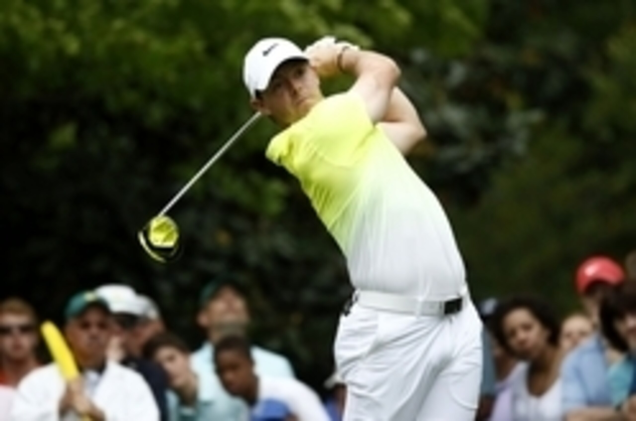 Apr 12, 2015; Augusta, GA, USA; Rory McIlroy hits his tee shot on the 7th hole during the final round of The Masters golf tournament at Augusta National Golf Club. Mandatory Credit: Rob Schumacher-USA TODAY Sports