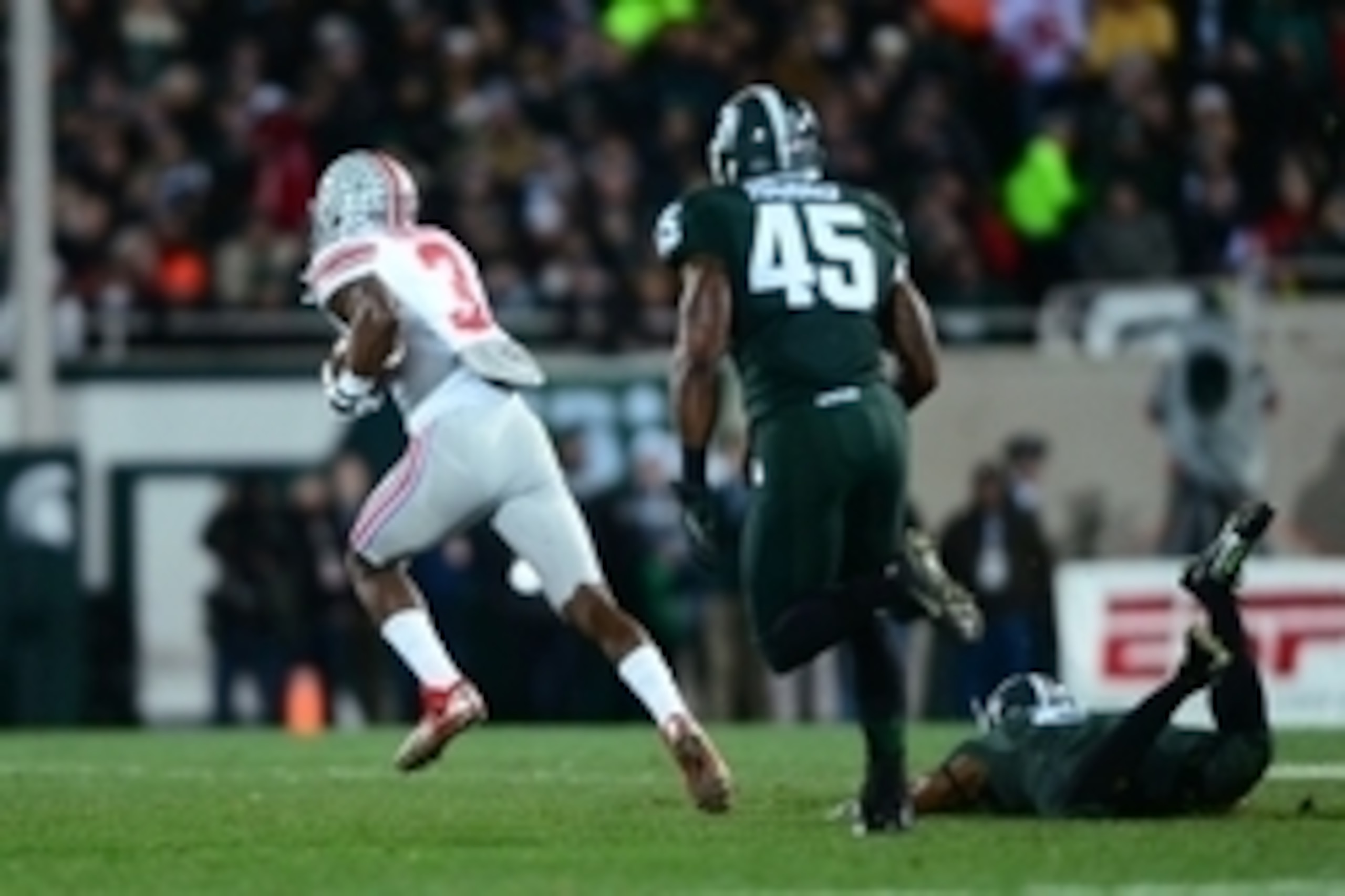 Nov 8, 2014; East Lansing, MI, USA; Ohio State Buckeyes wide receiver Michael Thomas (3) makes a catch while being defended by Michigan State Spartans cornerback Darian Hicks (2) and runs to the end zone for a touchdown during the second quarter at Sparta