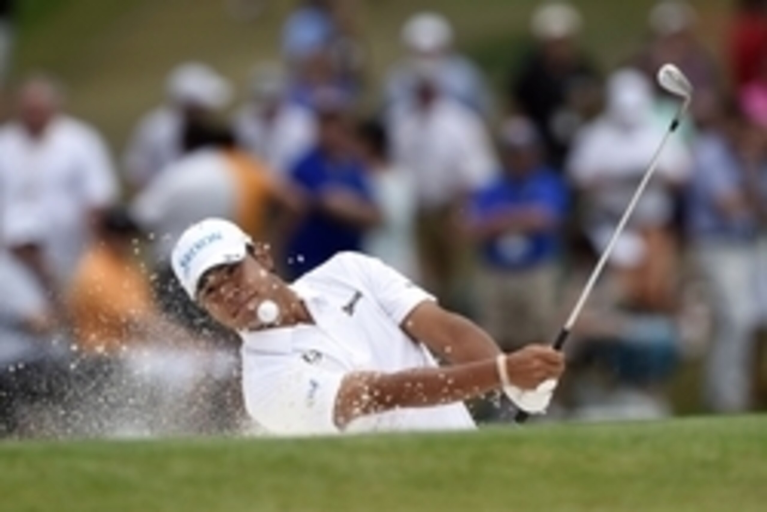 Apr 12, 2015; Augusta, GA, USA; Hideki Matsuyama hits out of a bunker on the 7th hole during the final round of The Masters golf tournament at Augusta National Golf Club. Mandatory Credit: Michael Madrid-USA TODAY Sports