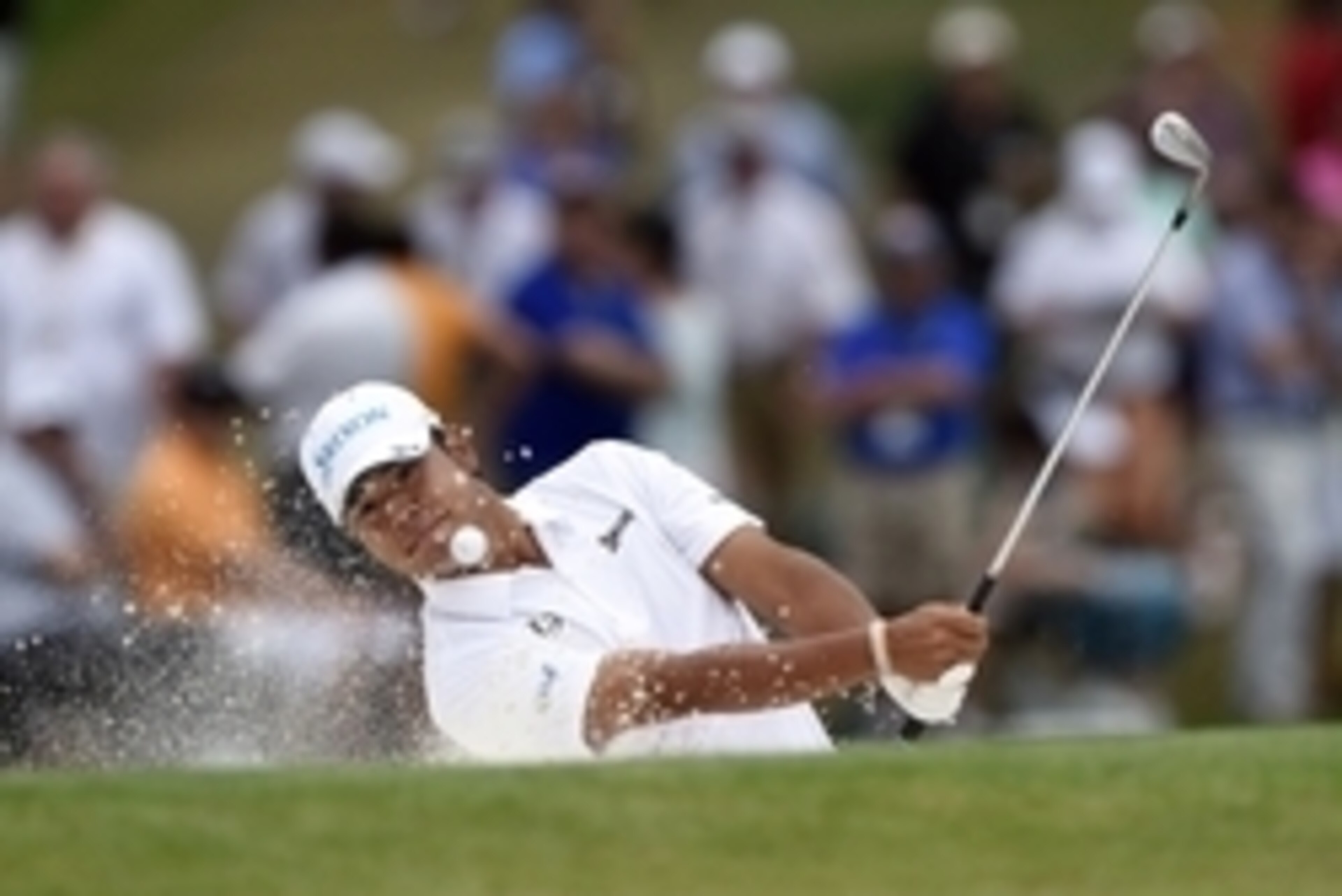 Apr 12, 2015; Augusta, GA, USA; Hideki Matsuyama hits out of a bunker on the 7th hole during the final round of The Masters golf tournament at Augusta National Golf Club. Mandatory Credit: Michael Madrid-USA TODAY Sports