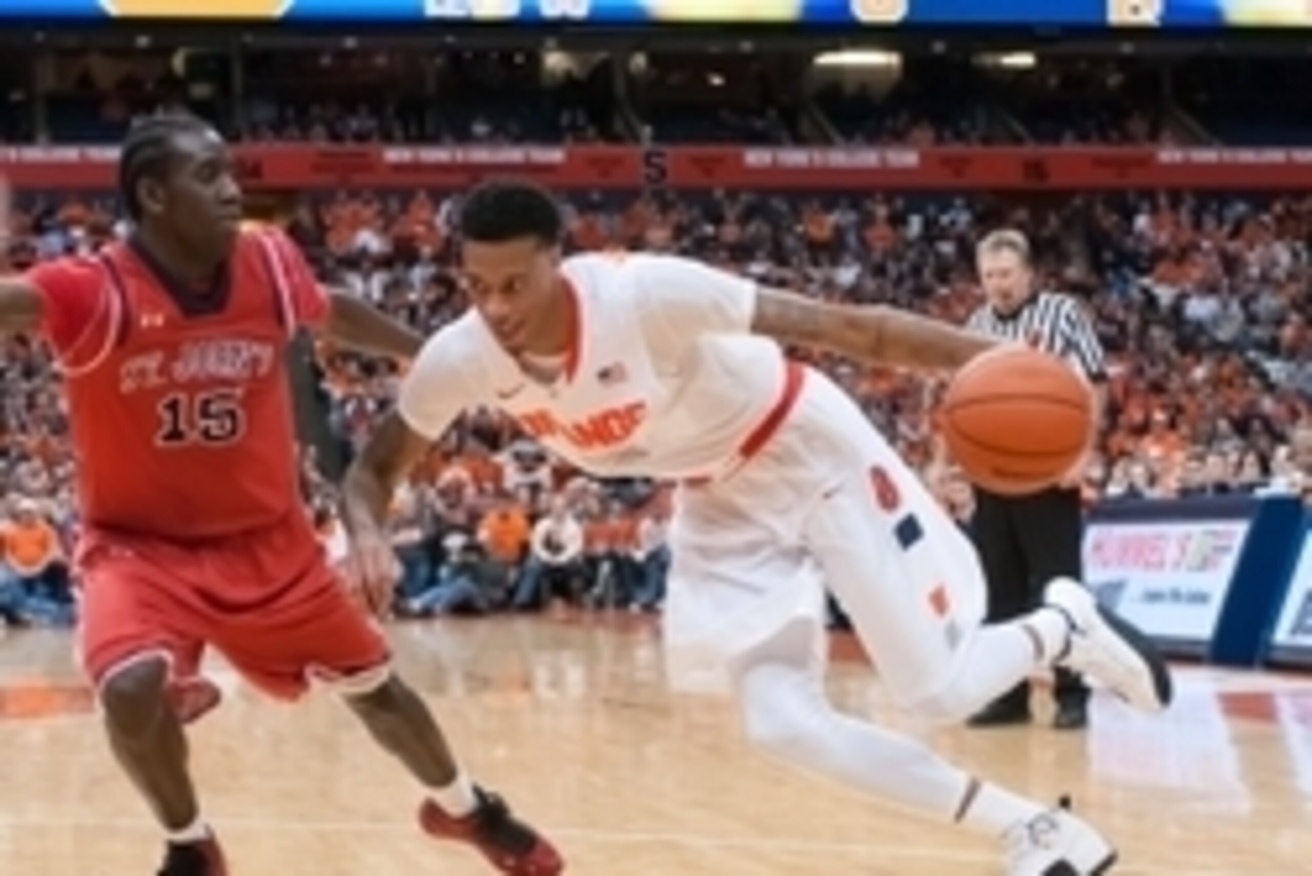 Dec 6, 2014; Syracuse, NY, USA; Syracuse Orange forward Chris McCullough (5) drives the ball on St. John's Red Storm guard Sir'Dominic Pointer (15)  during the second half of a game at the at Carrier Dome. Mandatory Credit: Mark Konezny-USA TODAY Sports