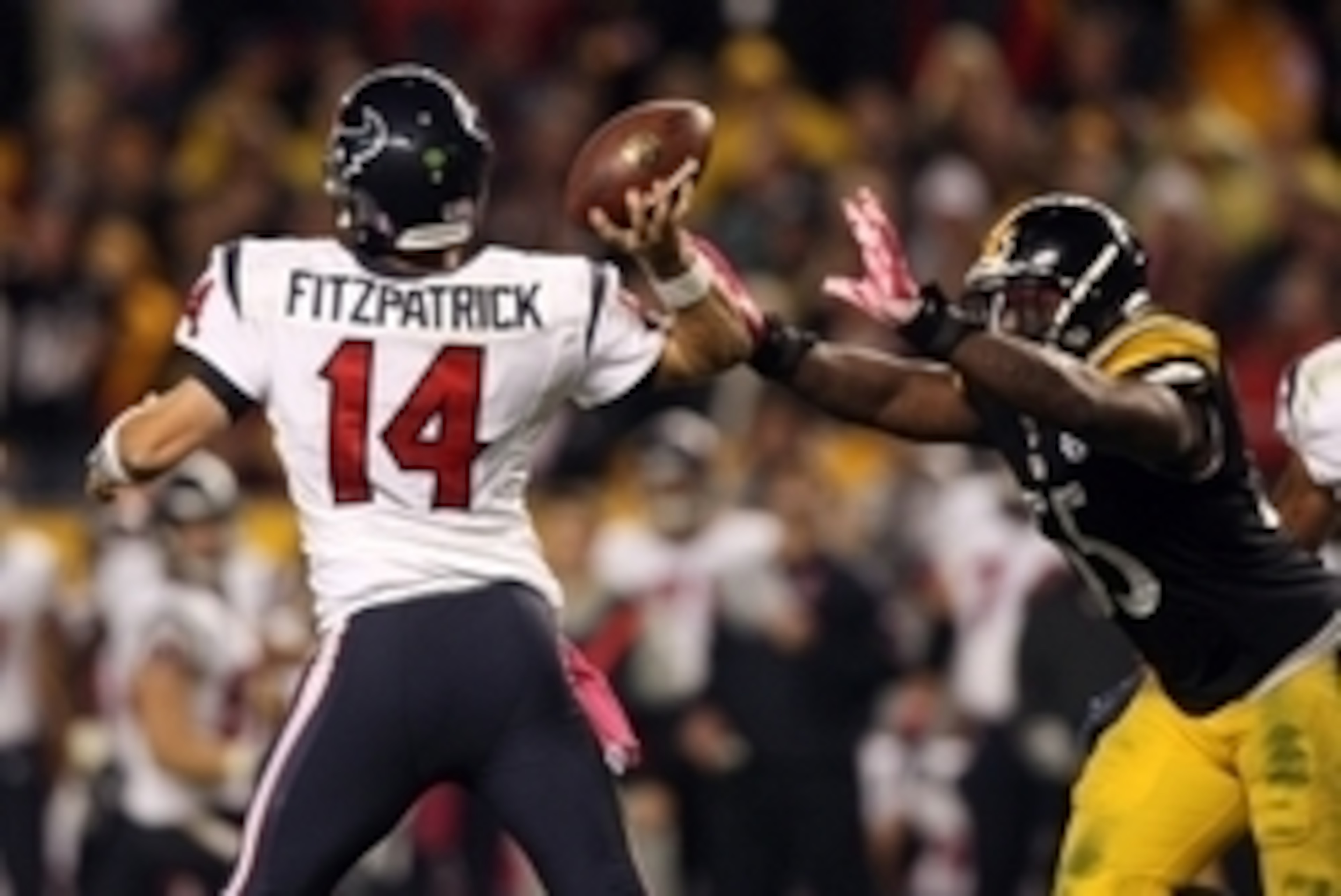 Oct 20, 2014; Pittsburgh, PA, USA; Pittsburgh Steelers linebacker Arthur Moats (55) pressures Houston Texans quarterback Ryan Fitzpatrick (14) during the second half at Heinz Field. The Steelers won the game, 30-23. Mandatory Credit: Jason Bridge-USA TODA