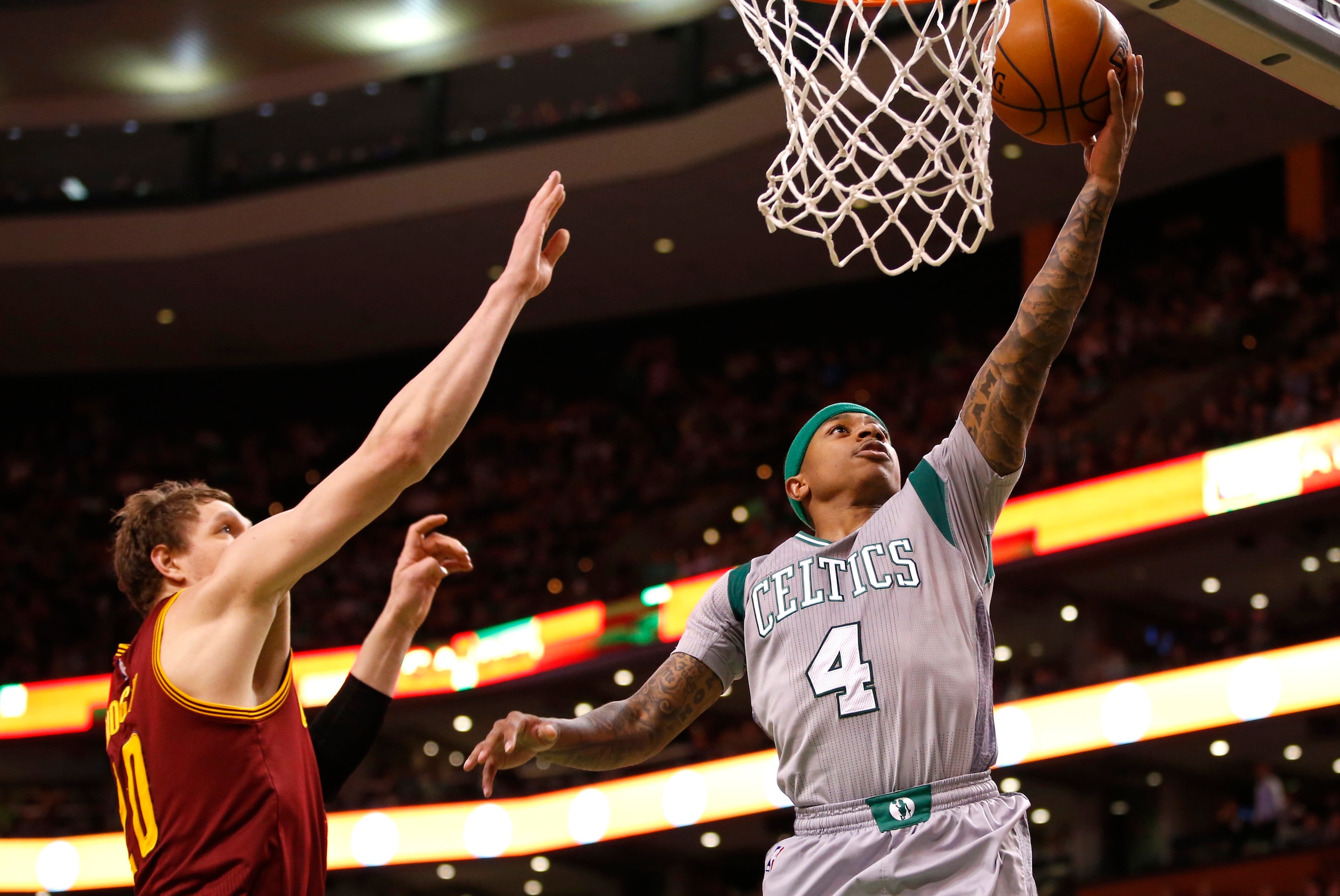 Apr 12, 2015; Boston, MA, USA; Boston Celtics guard Isaiah Thomas (4) drives to the basket against Cleveland Cavaliers center Timofey Mozgov (20) in the second half at TD Garden. The Celtics defeated the Cleveland Cavaliers 117-78. Mandatory Credit: David Apr 12, 2015; Boston, MA, USA; Boston Celtics guard Isaiah Thomas (4) drives to the basket against Cleveland Cavaliers center Timofey Mozgov (20) in the second half at TD Garden. The Celtics defeated the Cleveland Cavaliers 117-78. Mandatory Credit: David