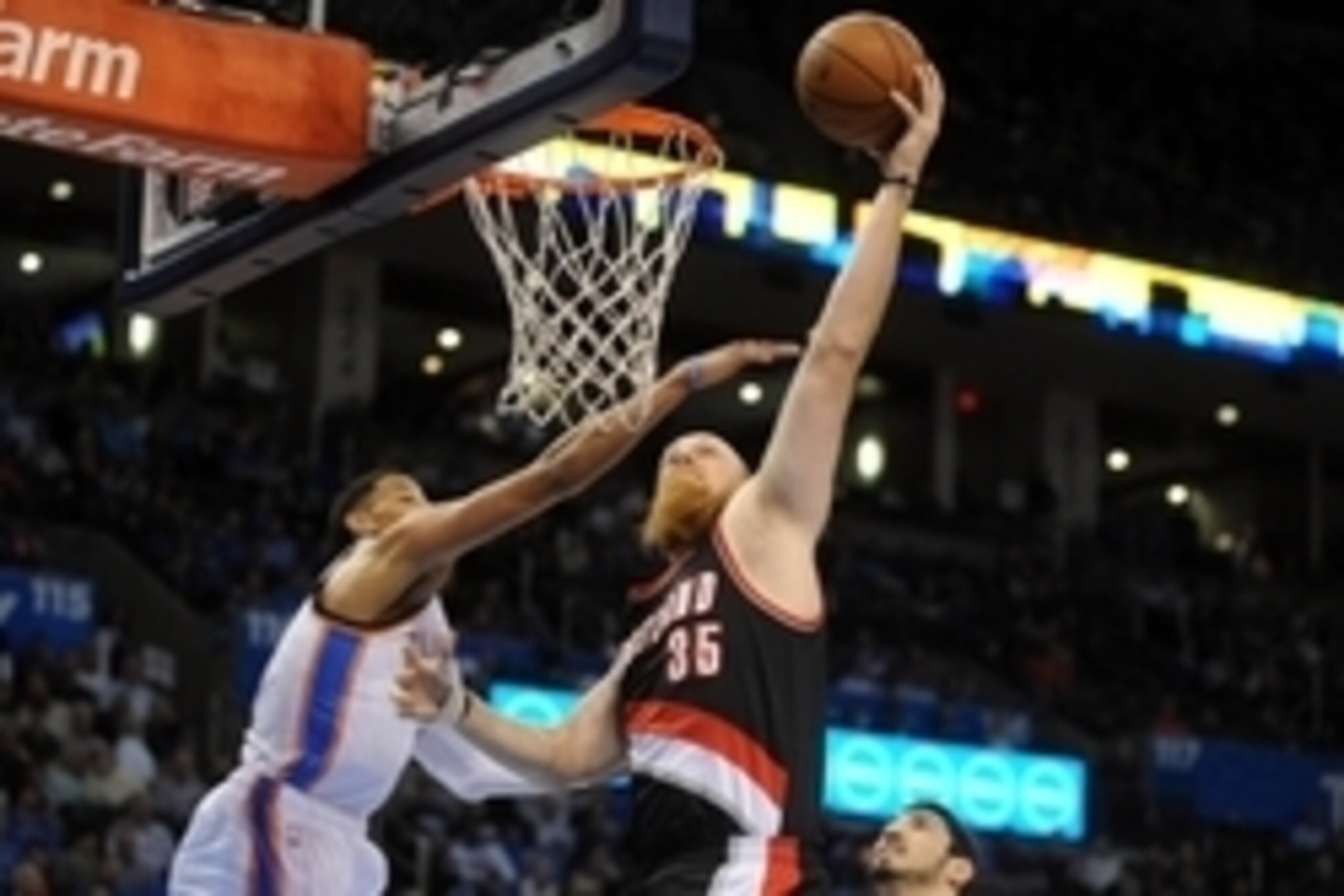 Apr 13, 2015; Oklahoma City, OK, USA; Portland Trail Blazers center Chris Kaman (35) dunks the ball against Oklahoma City Thunder guard Andre Roberson (21) during the first quarter at Chesapeake Energy Arena. Mandatory Credit: Mark D. Smith-USA TODAY Spor