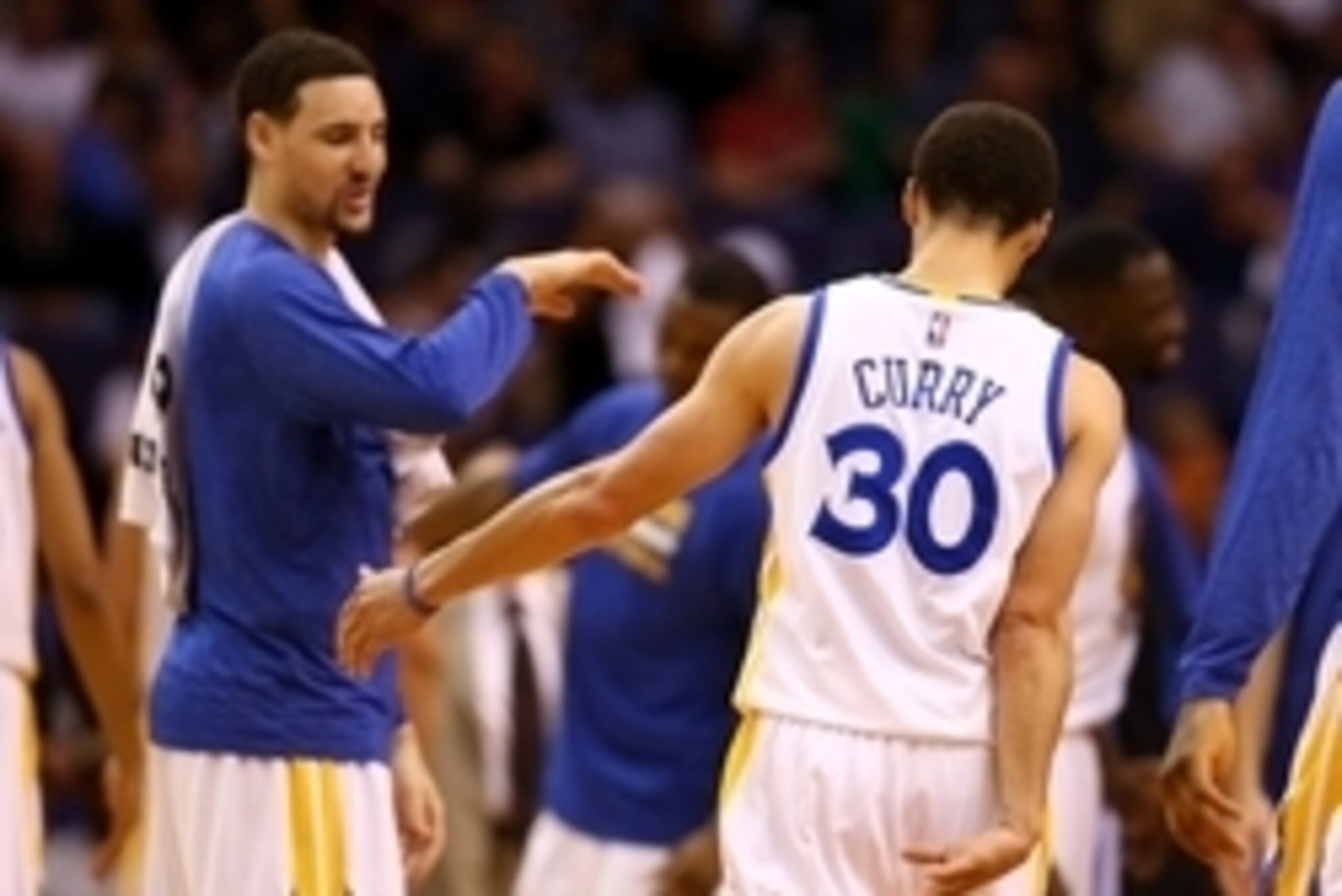 Mar 9, 2015; Phoenix, AZ, USA; Golden State Warriors guard Stephen Curry (30) celebrates a play with guard Klay Thompson against the Phoenix Suns at US Airways Center. The Warriors defeated the Suns 98-80. Mandatory Credit: Mark J. Rebilas-USA TODAY Sport
