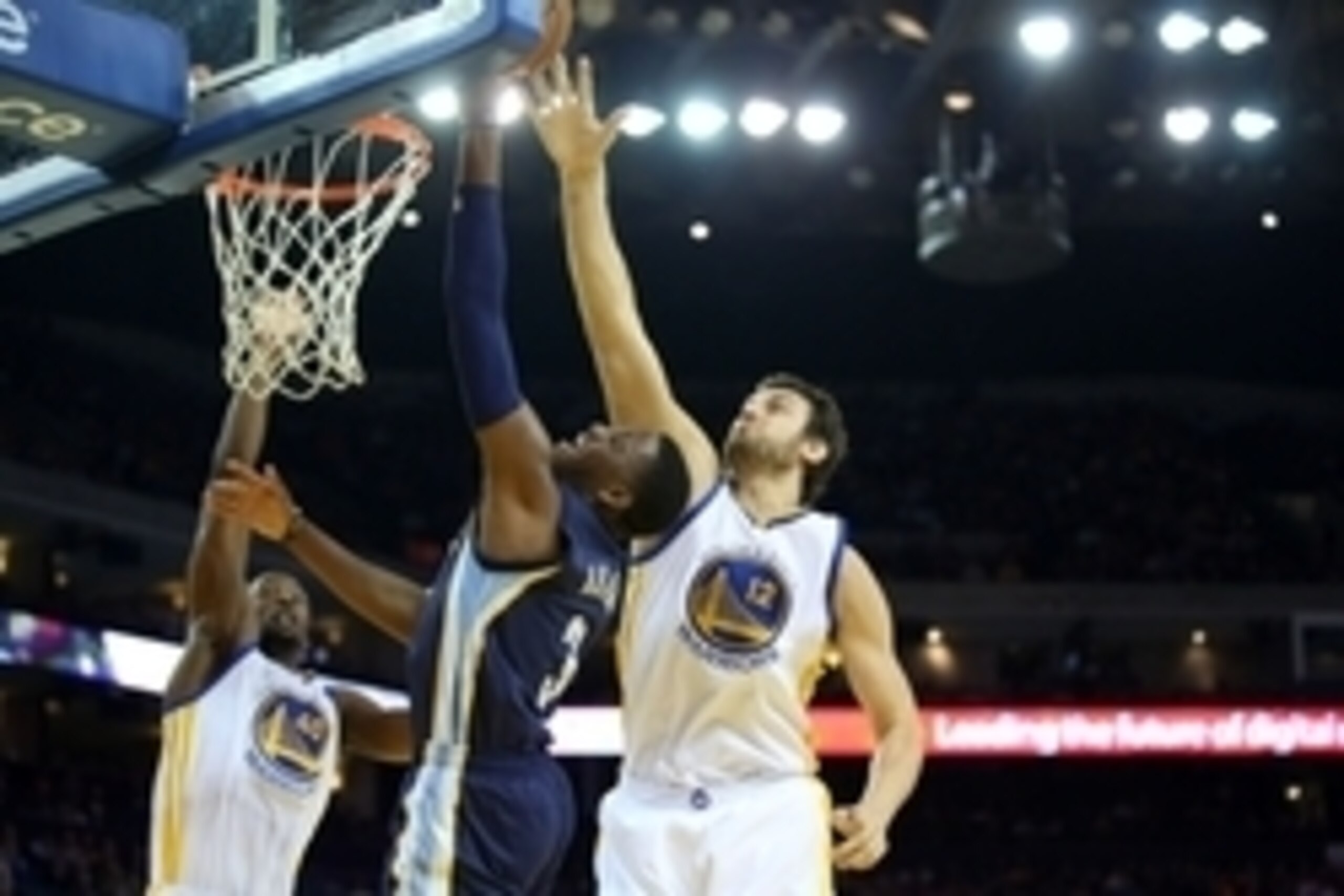 Apr 13, 2015; Oakland, CA, USA; Memphis Grizzlies guard Jordan Adams (3) is fouled by Golden State Warriors center Andrew Bogut (12) on a shot during the second quarter at Oracle Arena. Mandatory Credit: Kelley L Cox-USA TODAY Sports