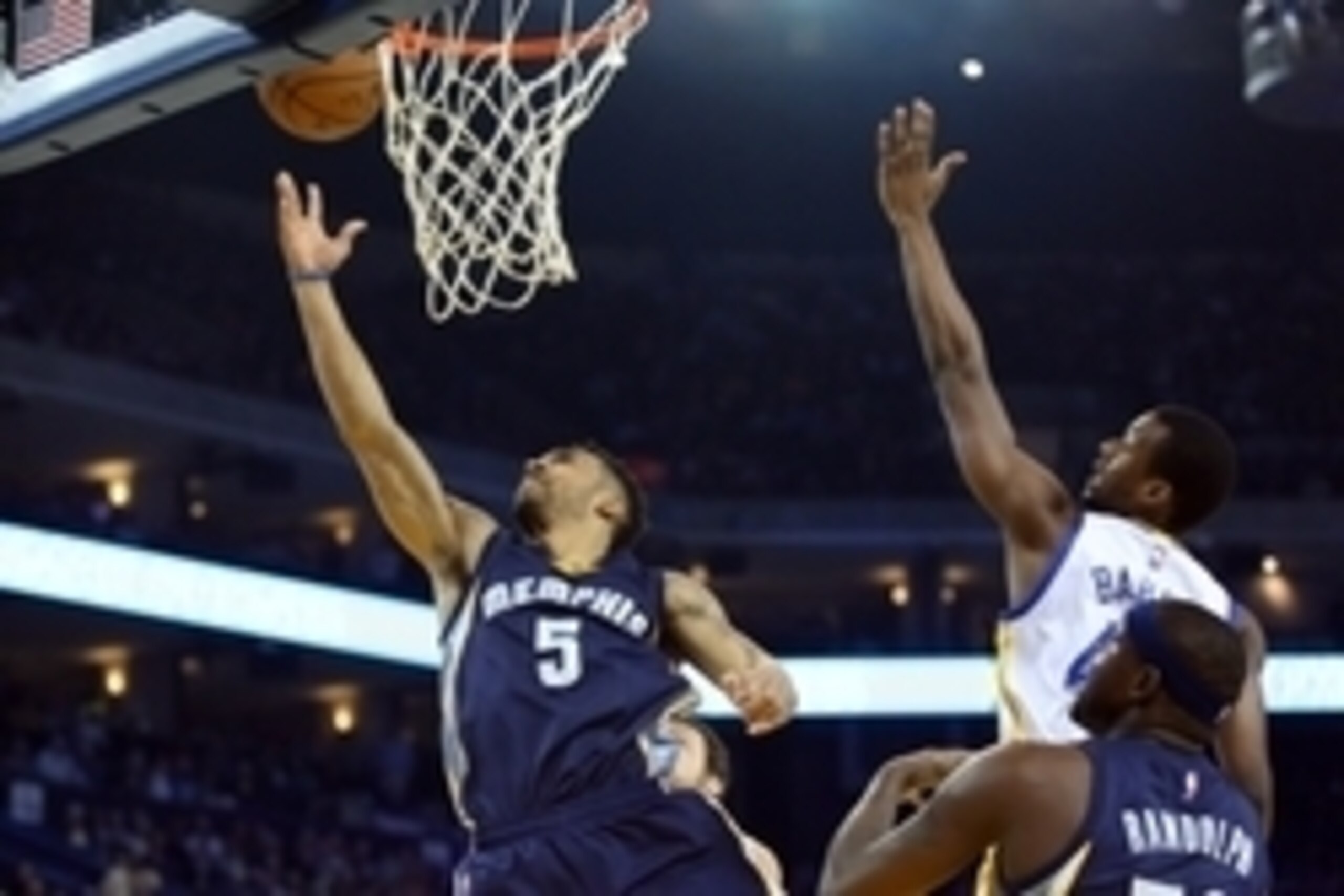 Apr 13, 2015; Oakland, CA, USA; Memphis Grizzlies guard Courtney Lee (5) scores a layup against Golden State Warriors forward Harrison Barnes (40) with forward Zach Randolph (50) during the first quarter at Oracle Arena. Mandatory Credit: Kelley L Cox-USA