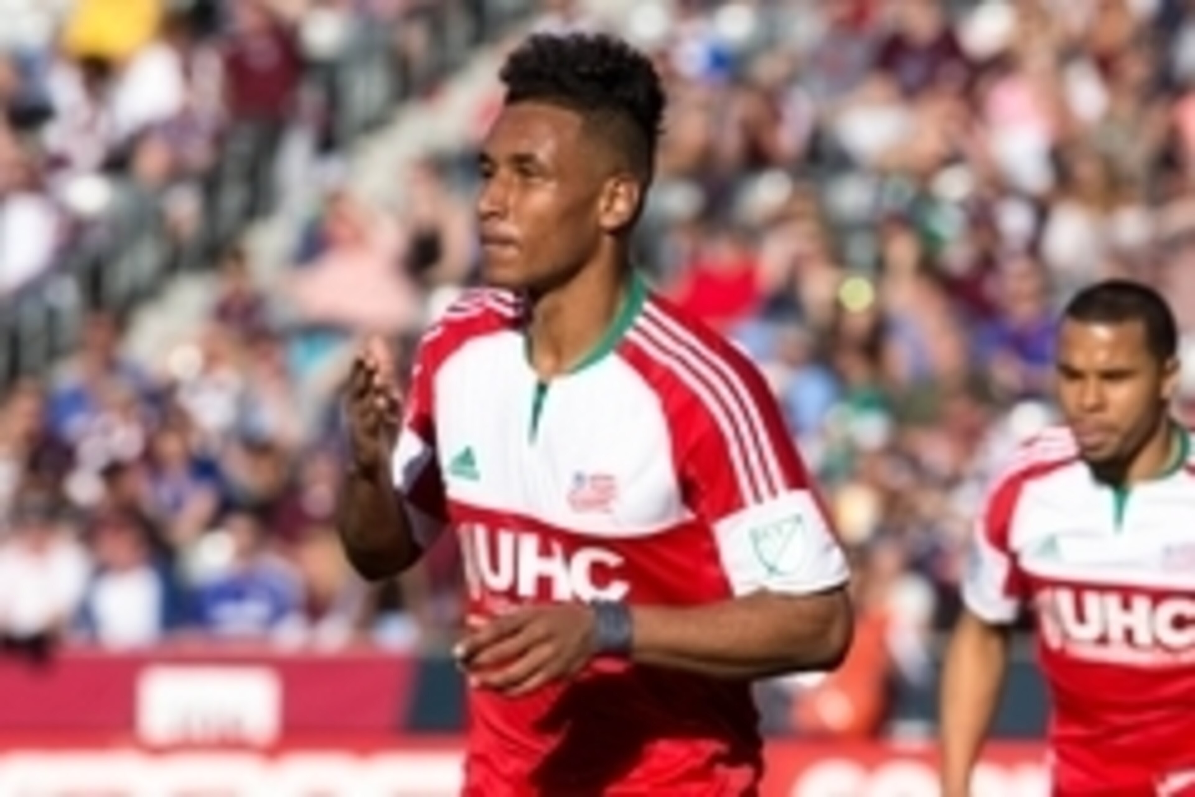 Apr 4, 2015; Commerce City, CO, USA; New England Revolution forward Juan Agudelo (17) reacts after scoring a goal in the first half against the Colorado Rapids at Dick's Sporting Goods Park. Mandatory Credit: Isaiah J. Downing-USA TODAY Sports
