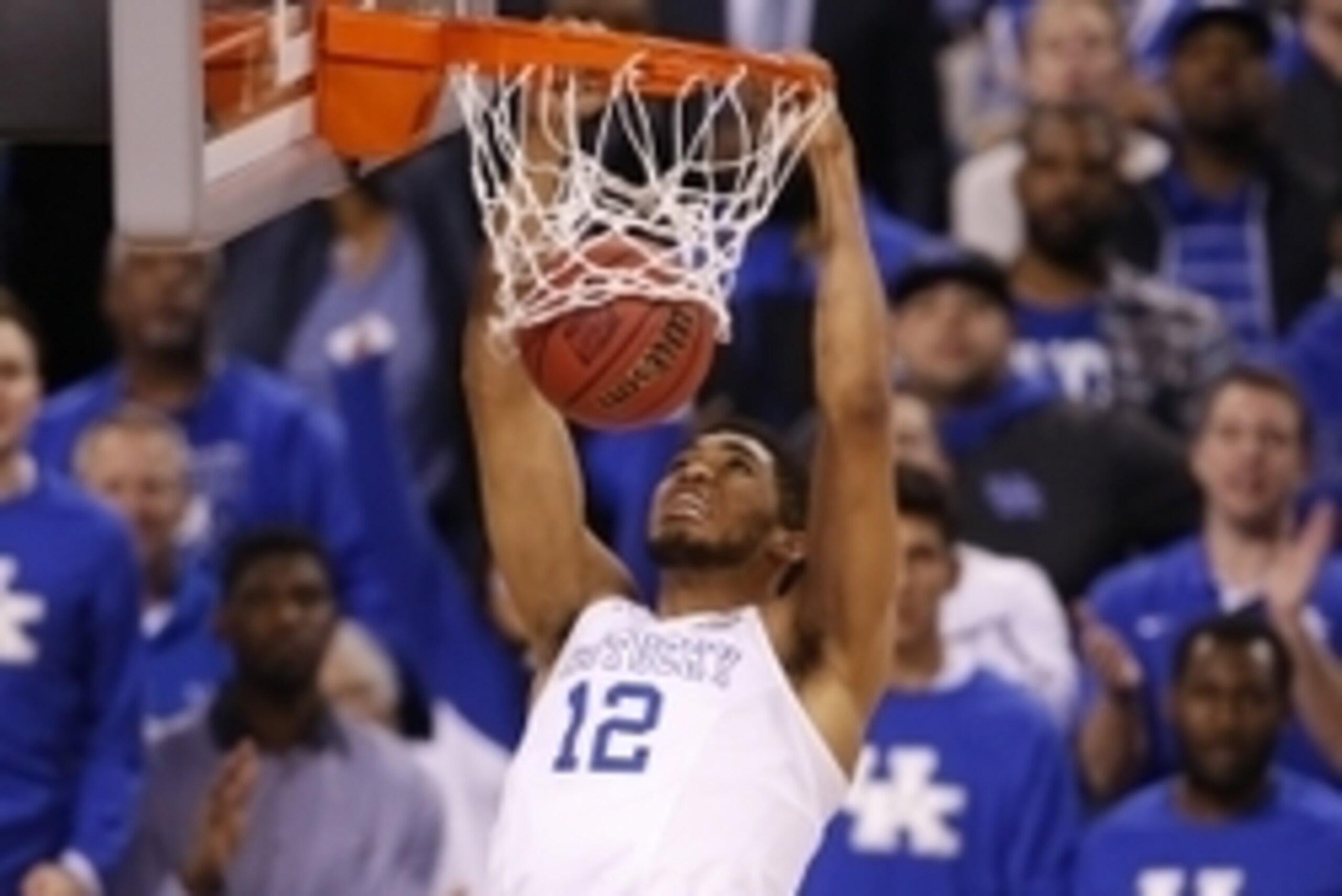 Apr 4, 2015; Indianapolis, IN, USA; Kentucky Wildcats forward Karl-Anthony Towns (12) dunks during the second half of the 2015 NCAA Men's Division I Championship semi-final game against the Wisconsin Badgers at Lucas Oil Stadium. Mandatory Credit: Brian S