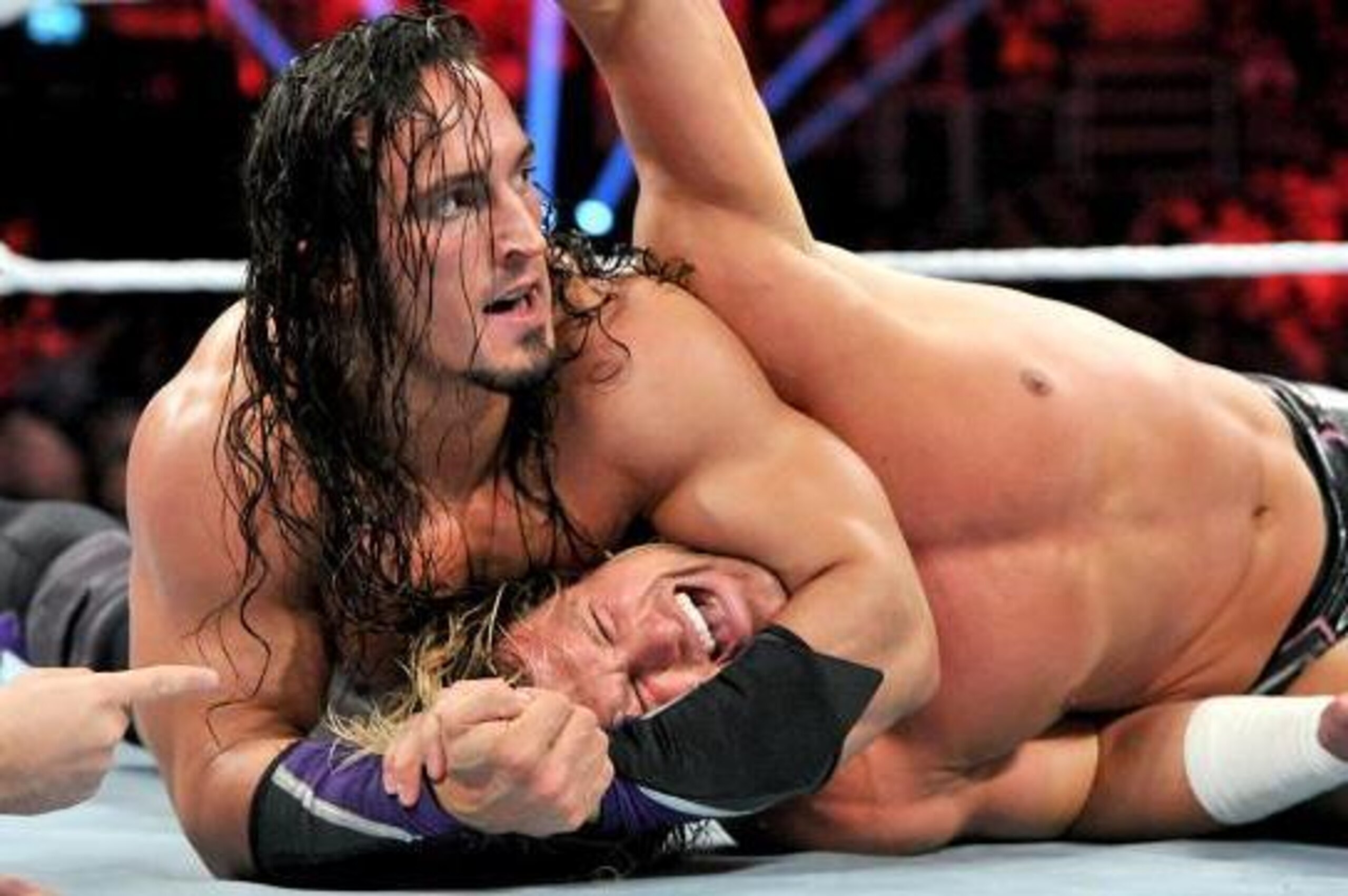 Neville grounds Dolph Ziggler.