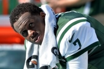 Dec 28, 2014; Miami Gardens, FL, USA; New York Jets quarterback Geno Smith (7) looks on from the bench during the second half against the Miami Dolphins at Sun Life Stadium. Mandatory Credit: Steve Mitchell-USA TODAY Sports