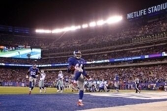 Nov 23, 2014; East Rutherford, NJ, USA; New York Giants running back Andre Williams (44) scores a touchdown against the Dallas Cowboys during the second quarter at MetLife Stadium. Mandatory Credit: Adam Hunger-USA TODAY Sports