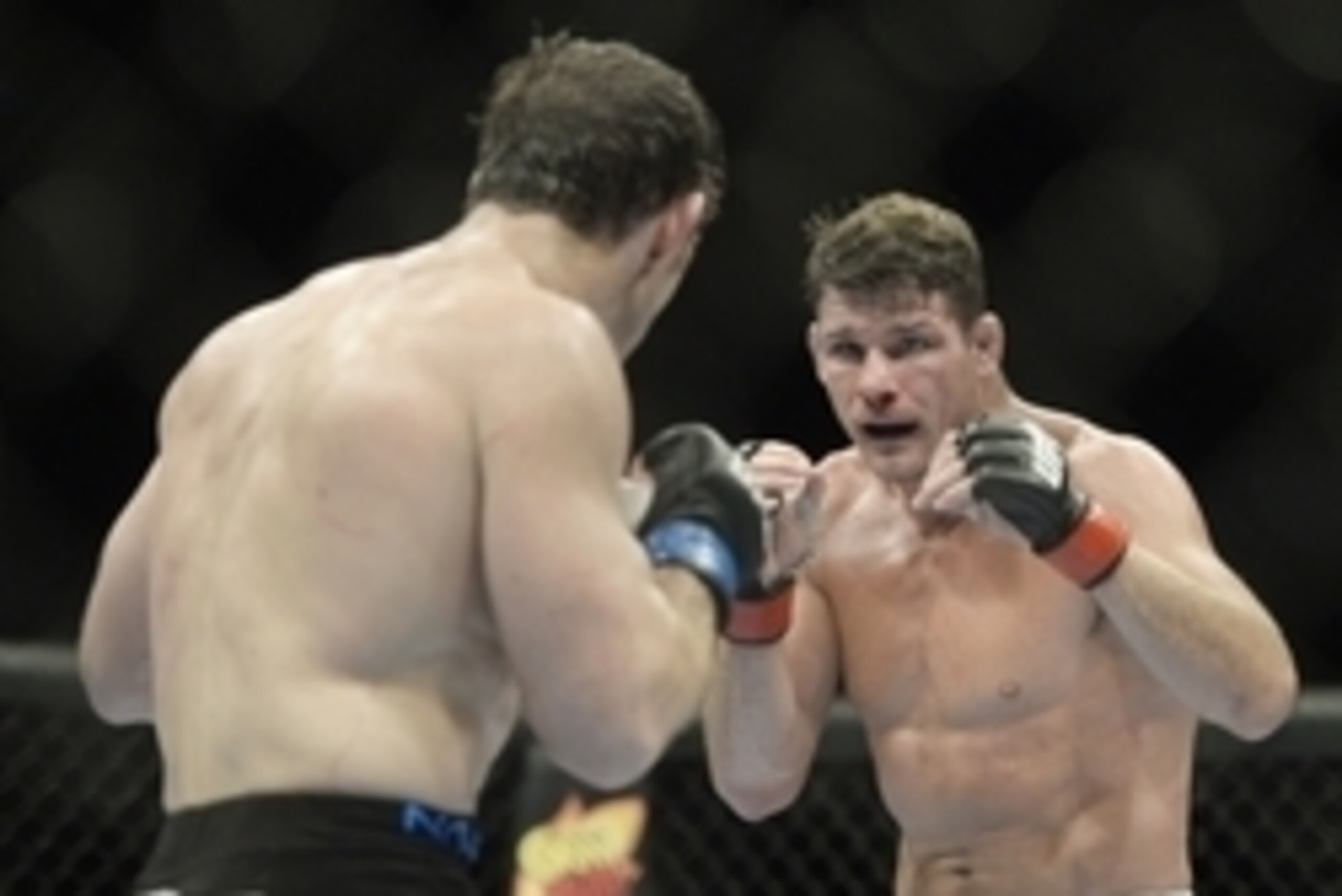 Apr 16, 2014; Quebec City, Quebec, Canada; Michael Bisping (red gloves) fights against Tim Kennedy (blue gloves) during their middleweight bout at Colisee Pepsi. Mandatory Credit: Eric Bolte-USA TODAY Sports