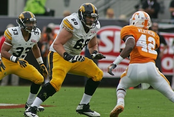 Jan 2, 2015; Jacksonville, FL, USA; Iowa Hawkeyes offensive lineman Brandon Scherff (68) gets ready to block Tennessee Volunteers linebacker Chris Weatherd (42) in the first quarter of the 2015 TaxSlayer Bowl at EverBank Field. The Tennessee Volunteers be