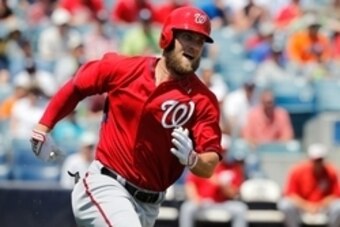 Apr 3, 2015; Tampa, FL, USA; Washington Nationals right fielder Bryce Harper (34) hits a RBI triple during the first inning against the New York Yankees at George M. Steinbrenner Field. Mandatory Credit: Kim Klement-USA TODAY Sports