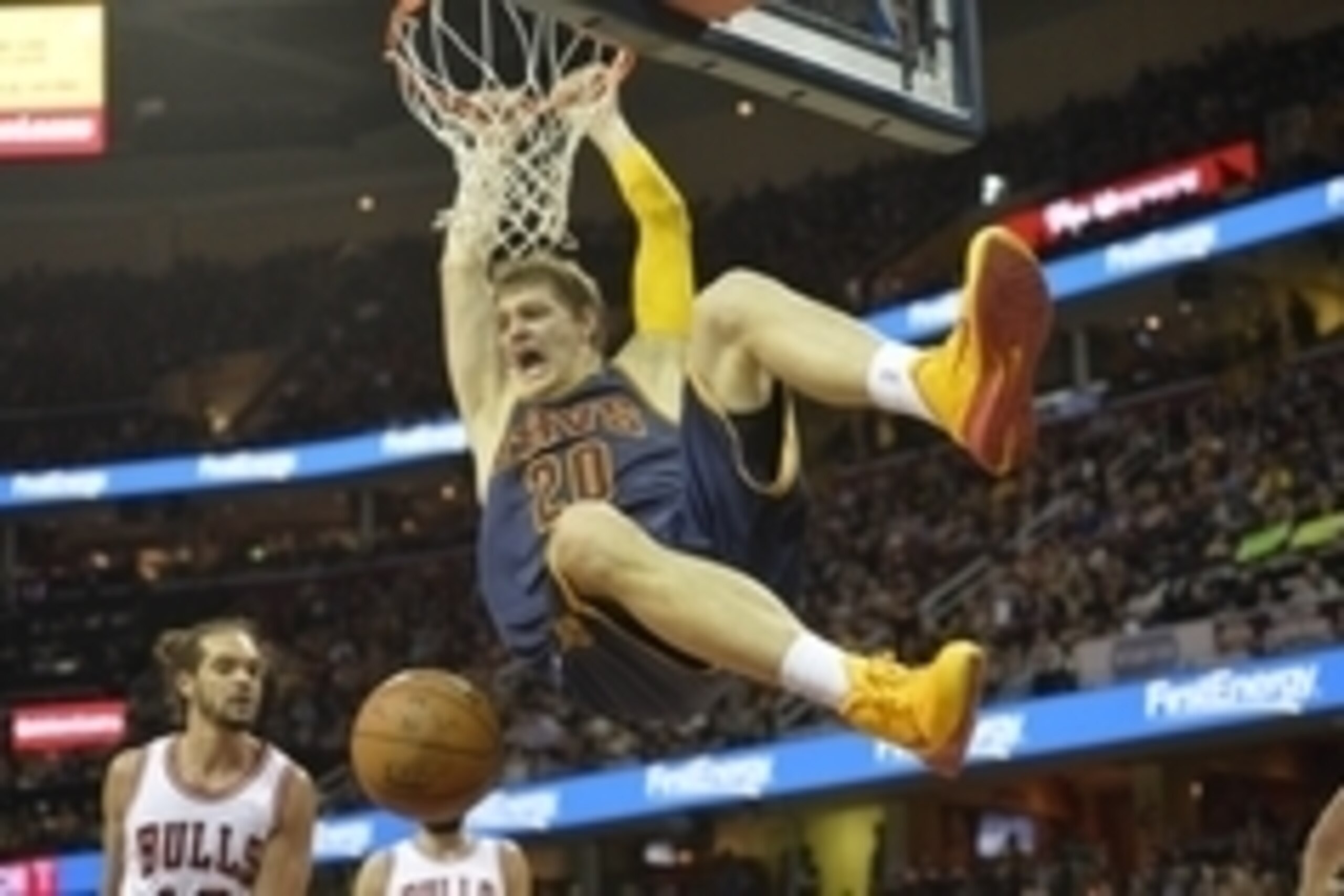 Apr 5, 2015; Cleveland, OH, USA; Cleveland Cavaliers center Timofey Mozgov (20) dunks the ball in the fourth quarter against the Chicago Bulls at Quicken Loans Arena. Mandatory Credit: David Richard-USA TODAY Sports